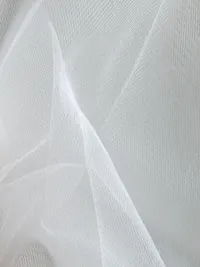 Translucent white mesh netting fabric close-up.