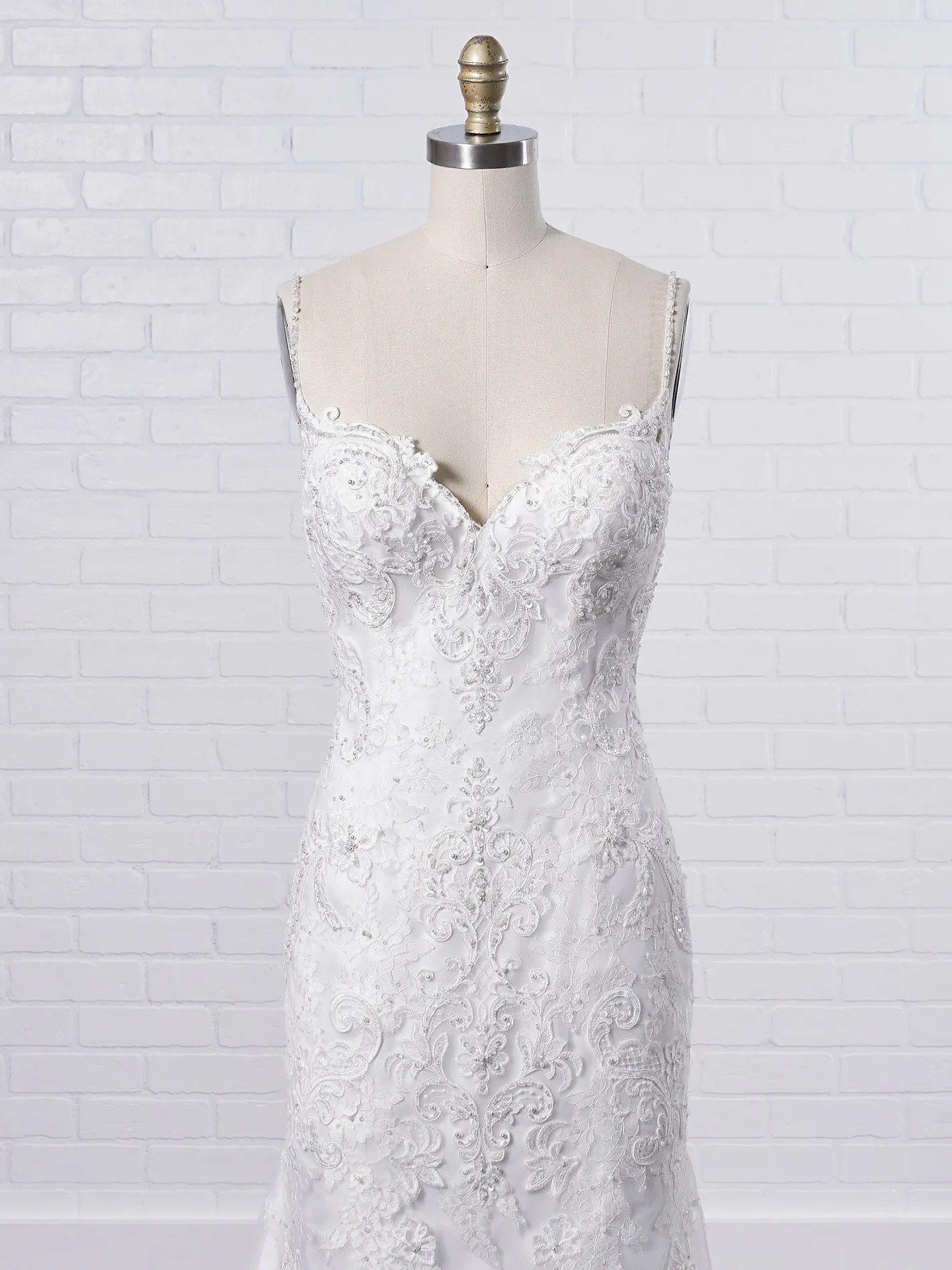 Maggie Sottero Glorietta Elegant fit-and-flare bridal dress featuring eye-catching lace motifs 9MC882 Color1