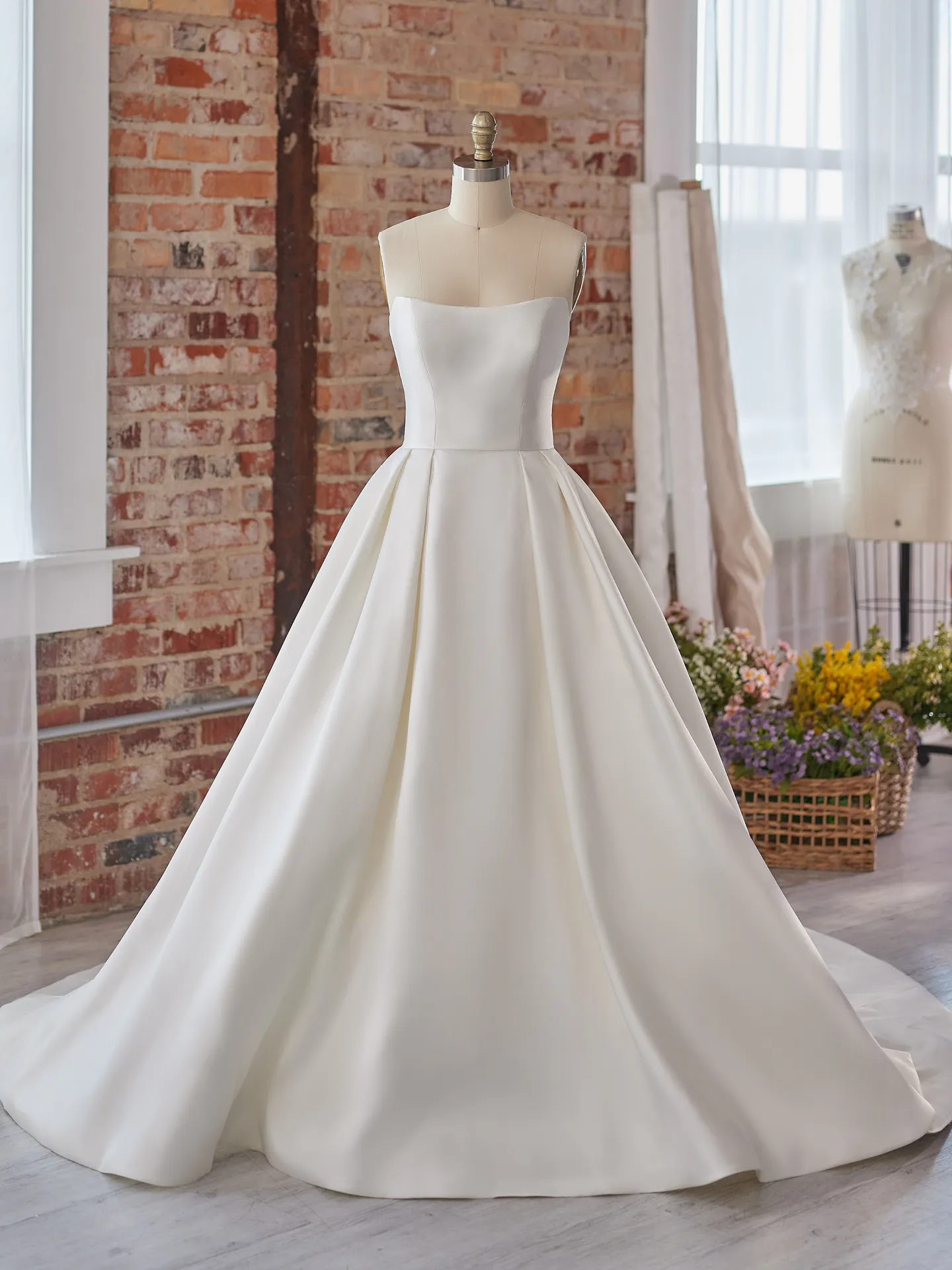 Maggie Sottero Selena satin A-line dress on mannequin front view
