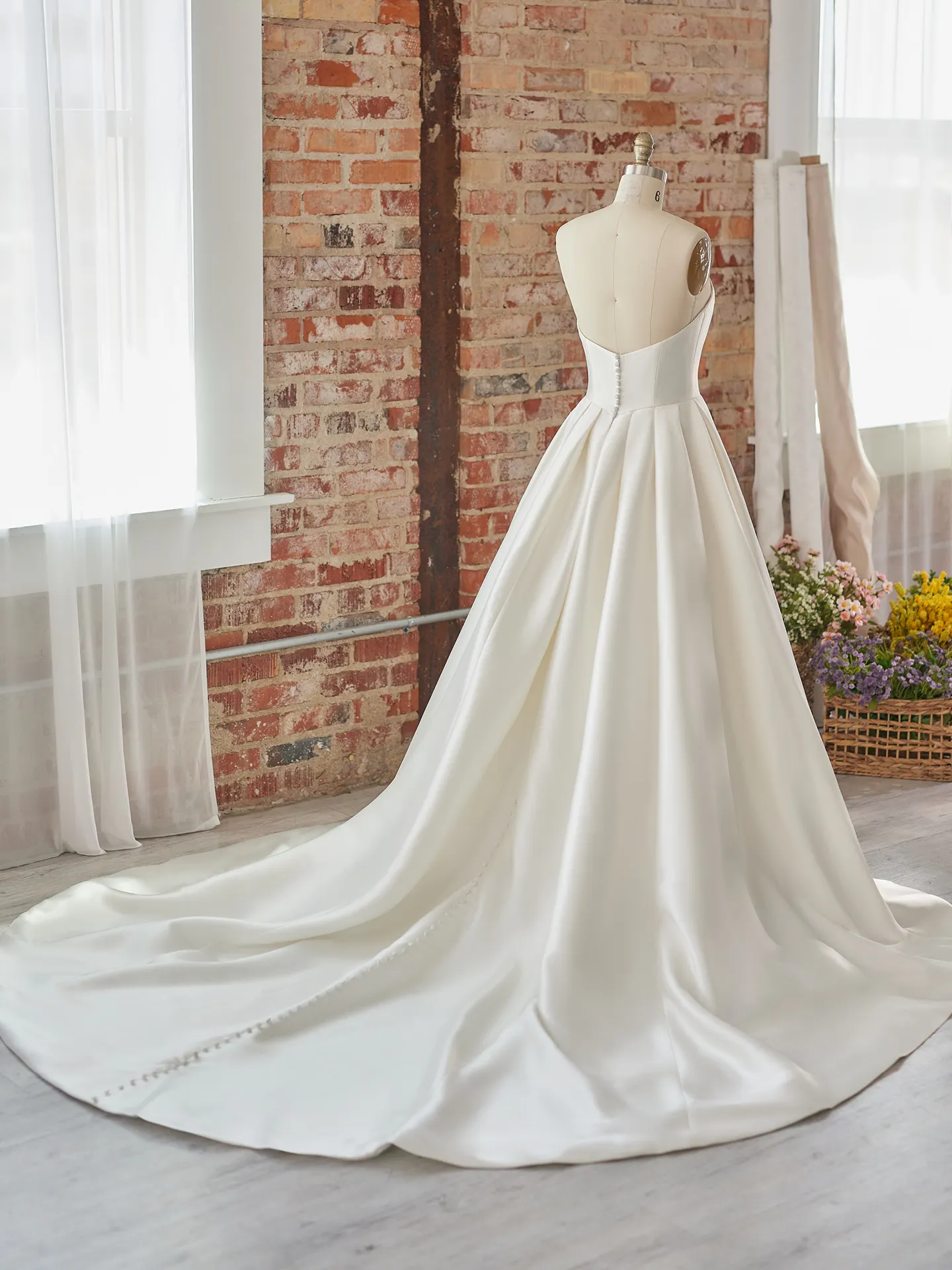 Maggie Sottero Selena satin A-line dress with pockets back view
