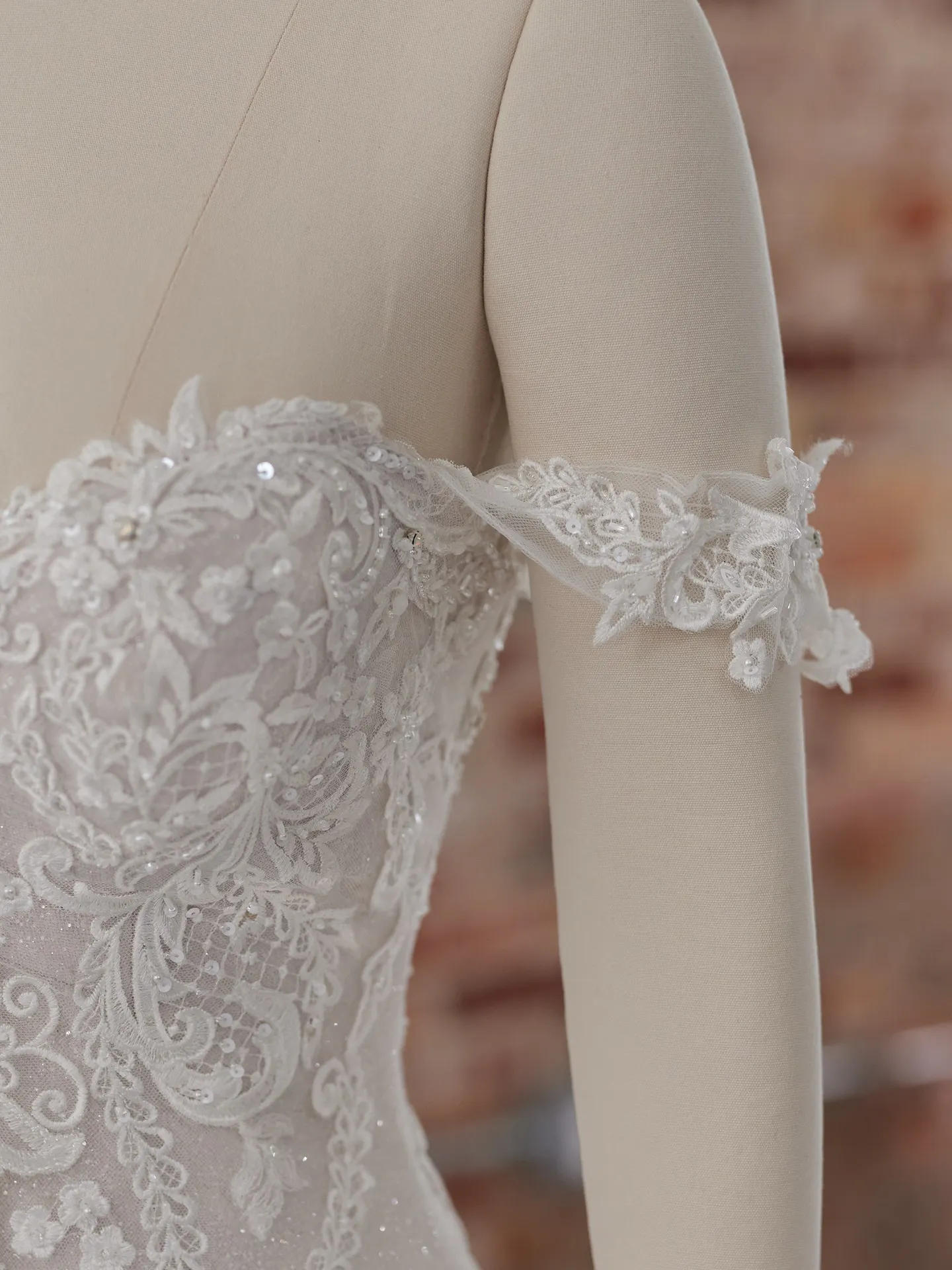 Maggie Sottero Frederique off-shoulder lace detail close-up