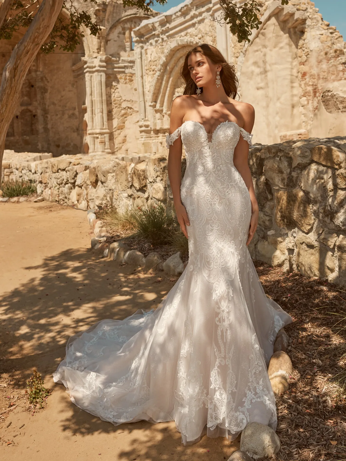 Maggie Sottero Frederique front view lace wedding dress with train in ruins setting