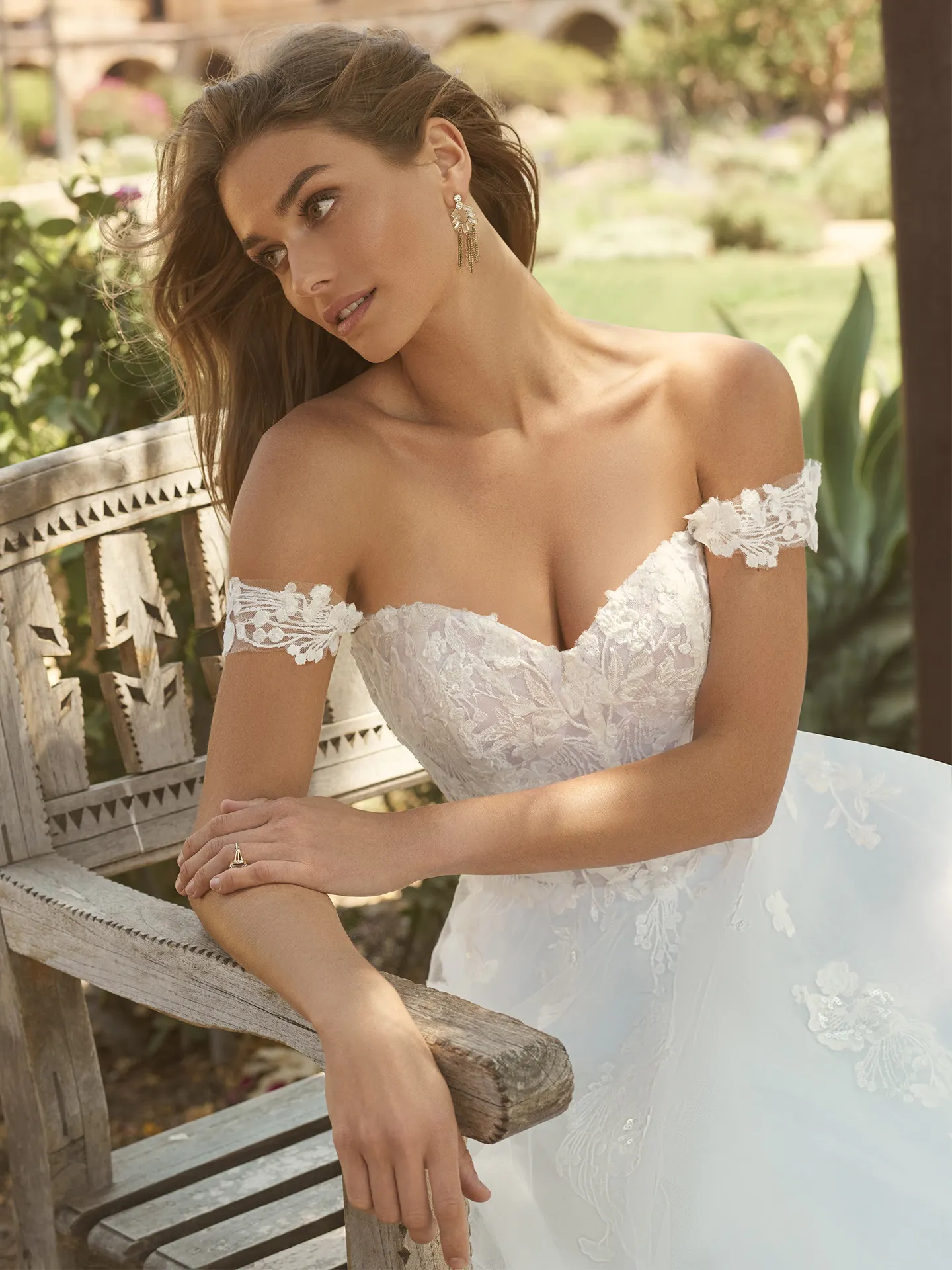 Maggie Sottero Harlem fairytale gown front view with off-the-shoulder lace bodice.