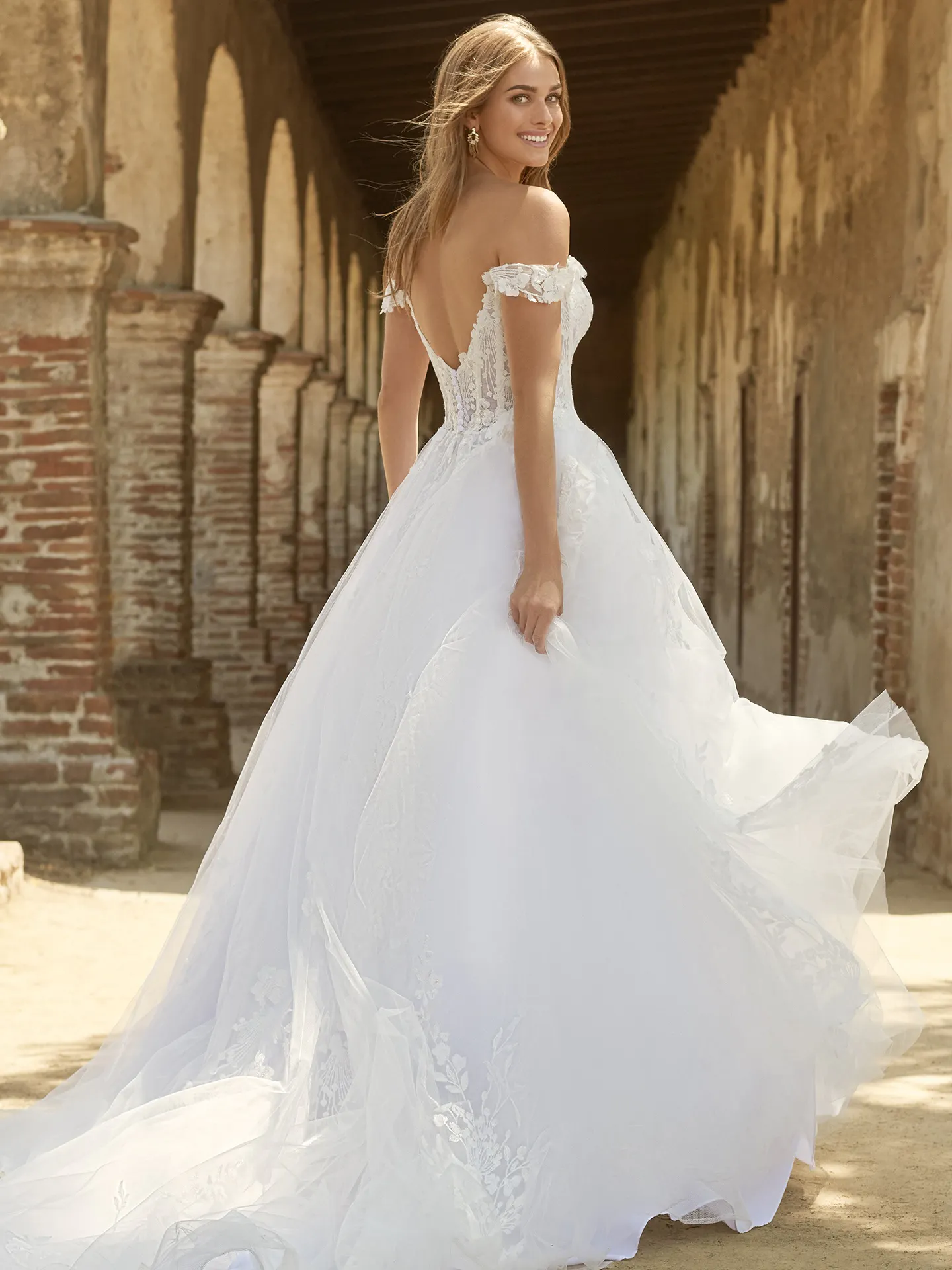 Maggie Sottero Harlem back view off-shoulder fairytale ballgown.