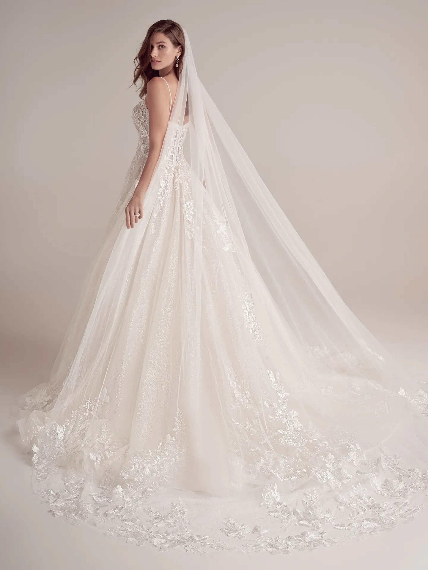 Casey cathedral-length veil, side view, romantic lace design with floral details and sheer fabric.