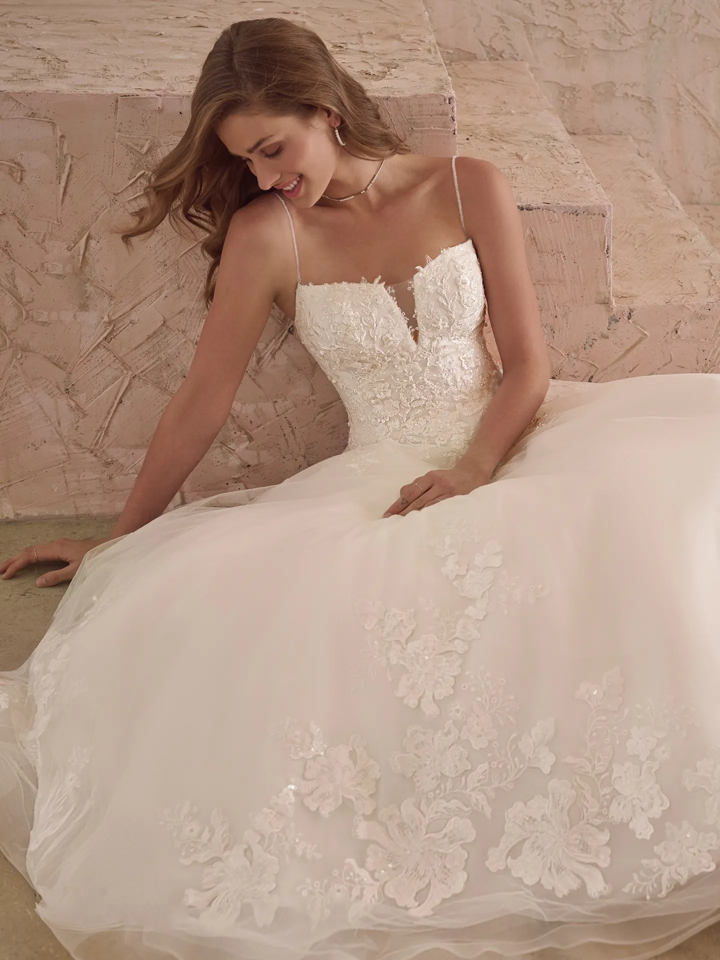 Maggie Sottero Casey sparkly ballgown wedding dress front view with lace detail.