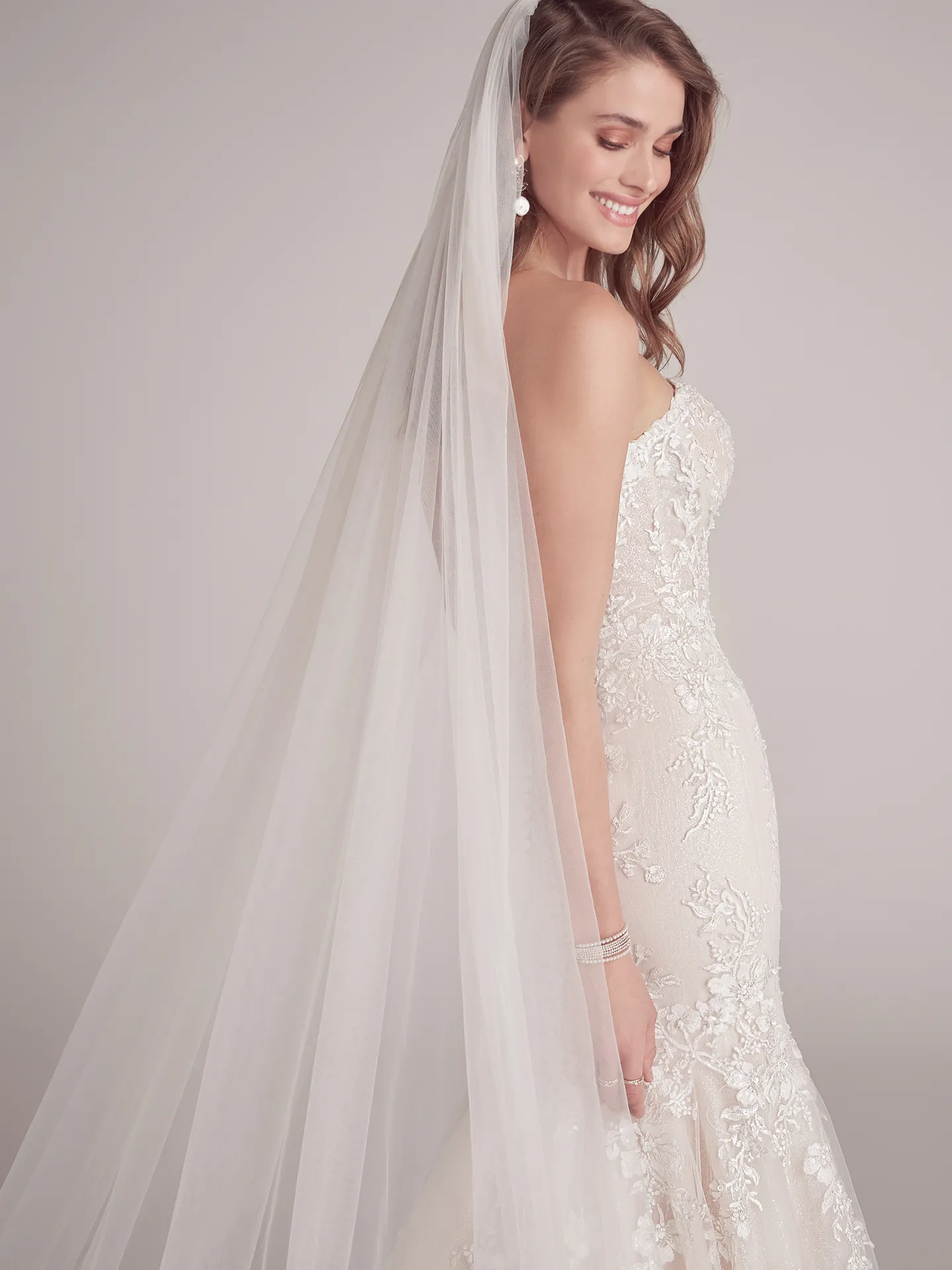 Maggie Sottero Lennon side view, floral beaded mermaid gown with veil.