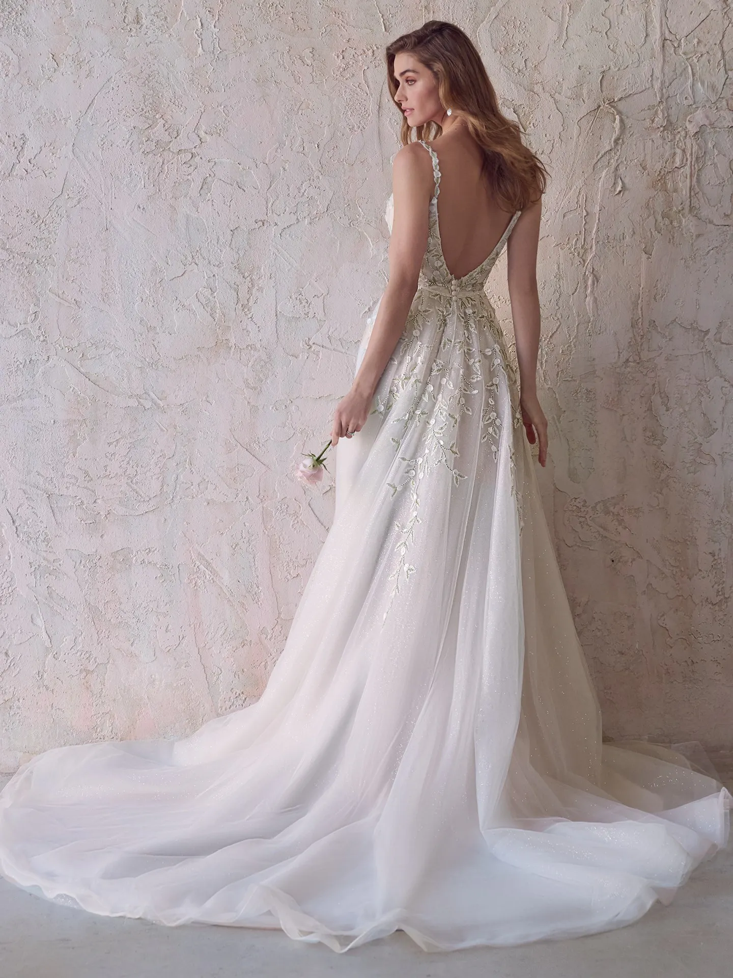 Maggie Sottero V-back beaded bridal dress back view.