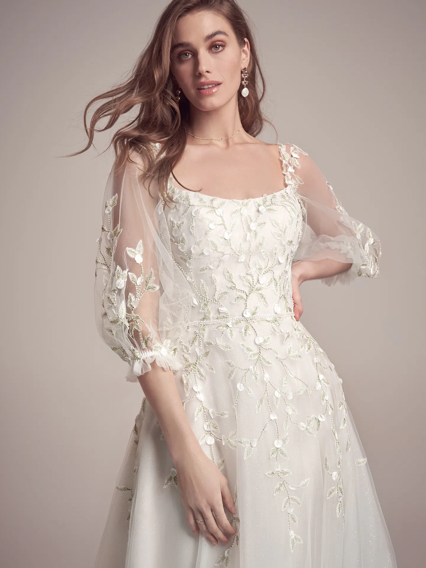 Maggie Sottero dress front view with detachable beaded puff sleeves and floral embroidery.