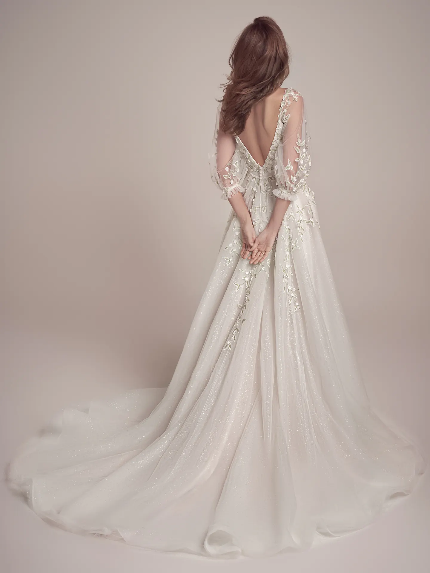 Maggie Sottero plunging V-back beaded dress back view.