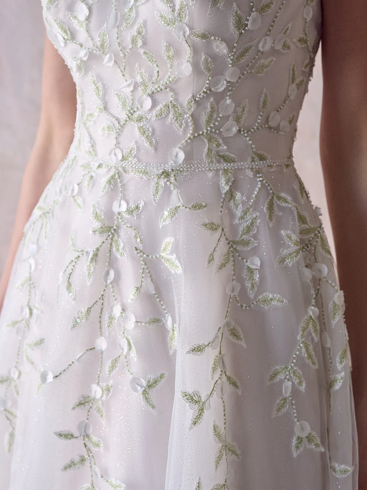 Maggie Sottero wedding dress floral embroidery close-up.