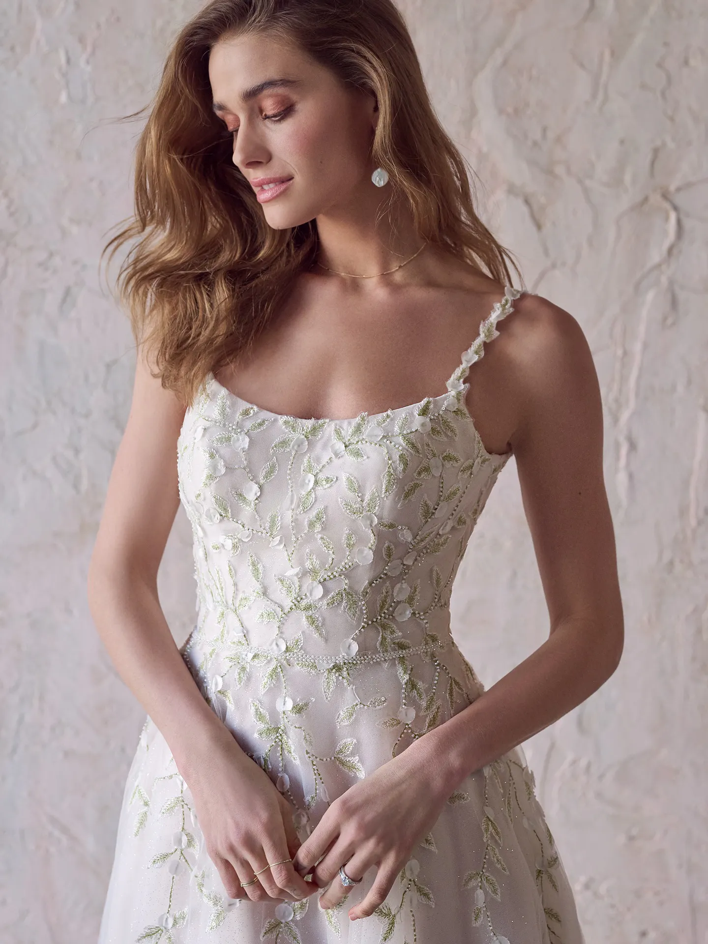 Maggie Sottero bridal dress side view with vine bead details on bodice