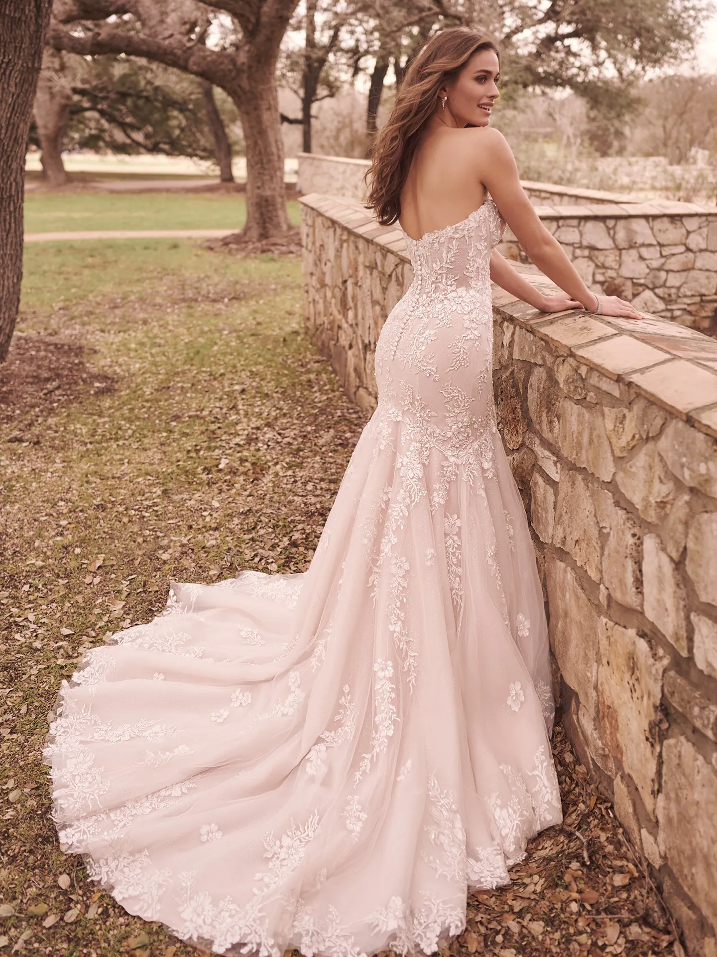 Lennon floral beaded mermaid bridal gown back view outdoors