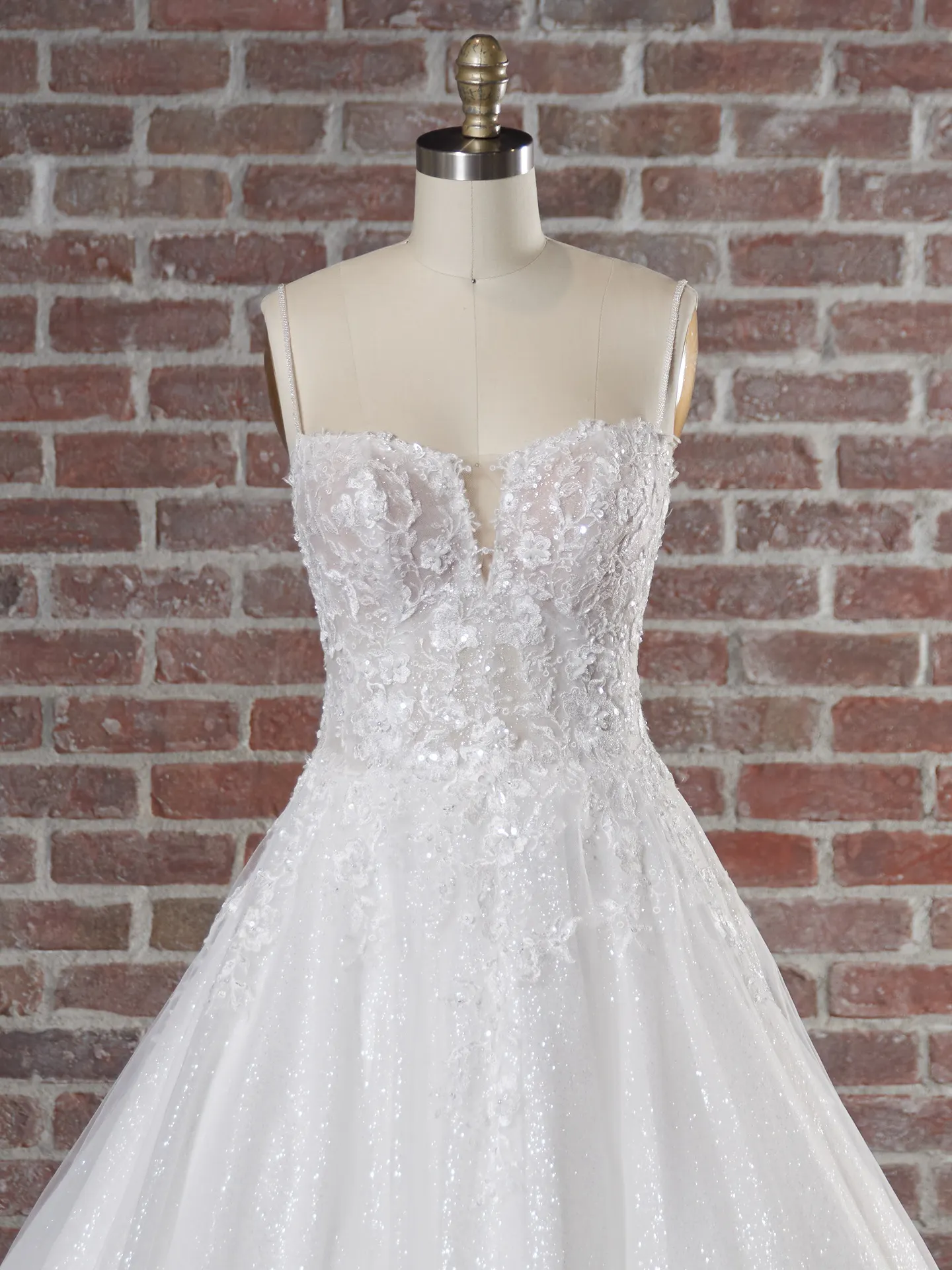 Casey sparkly ballgown bodice detail on mannequin in front of brick wall