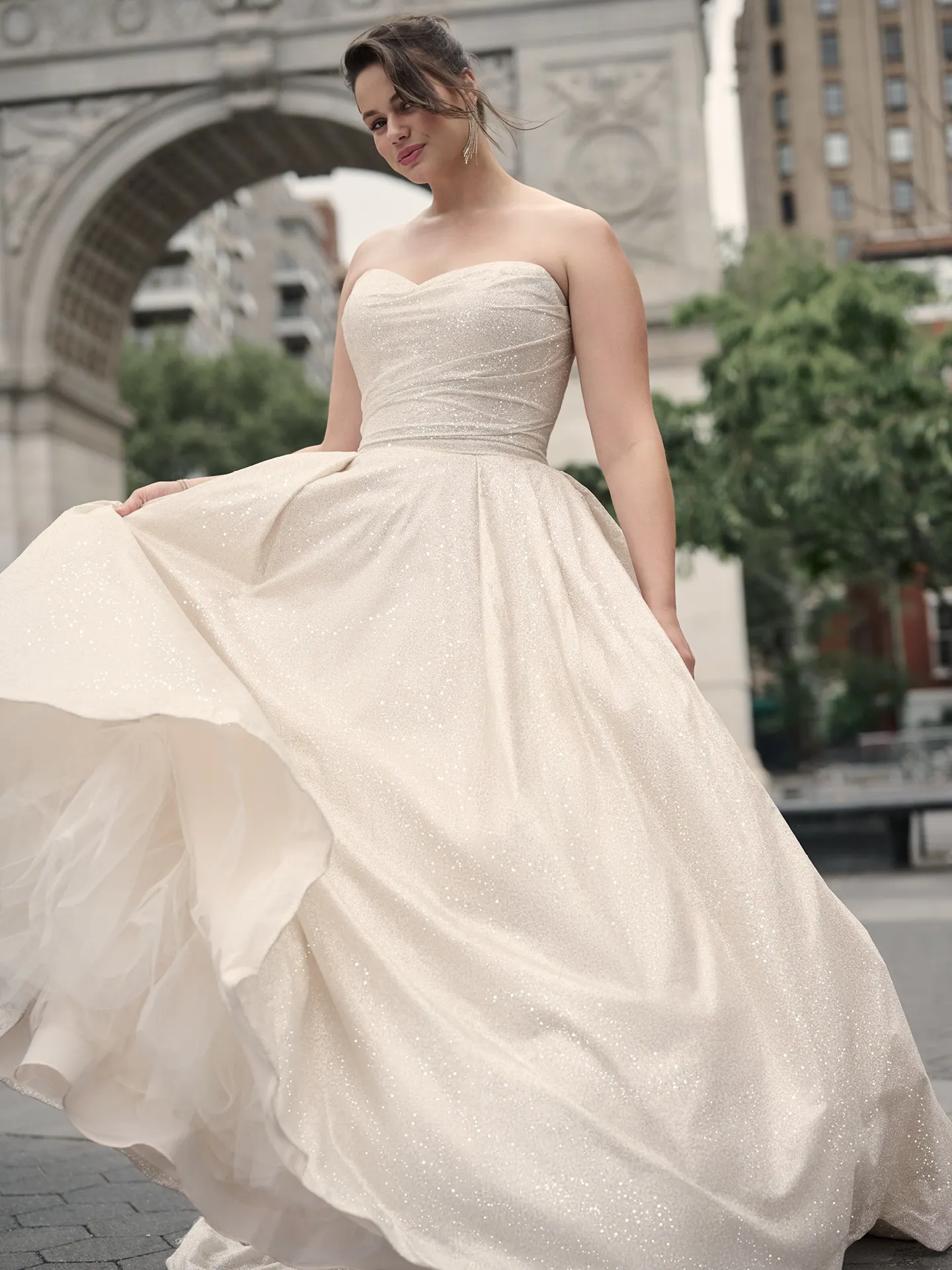 Maggie Sottero Anniston front view shimmery ballgown with arch in background