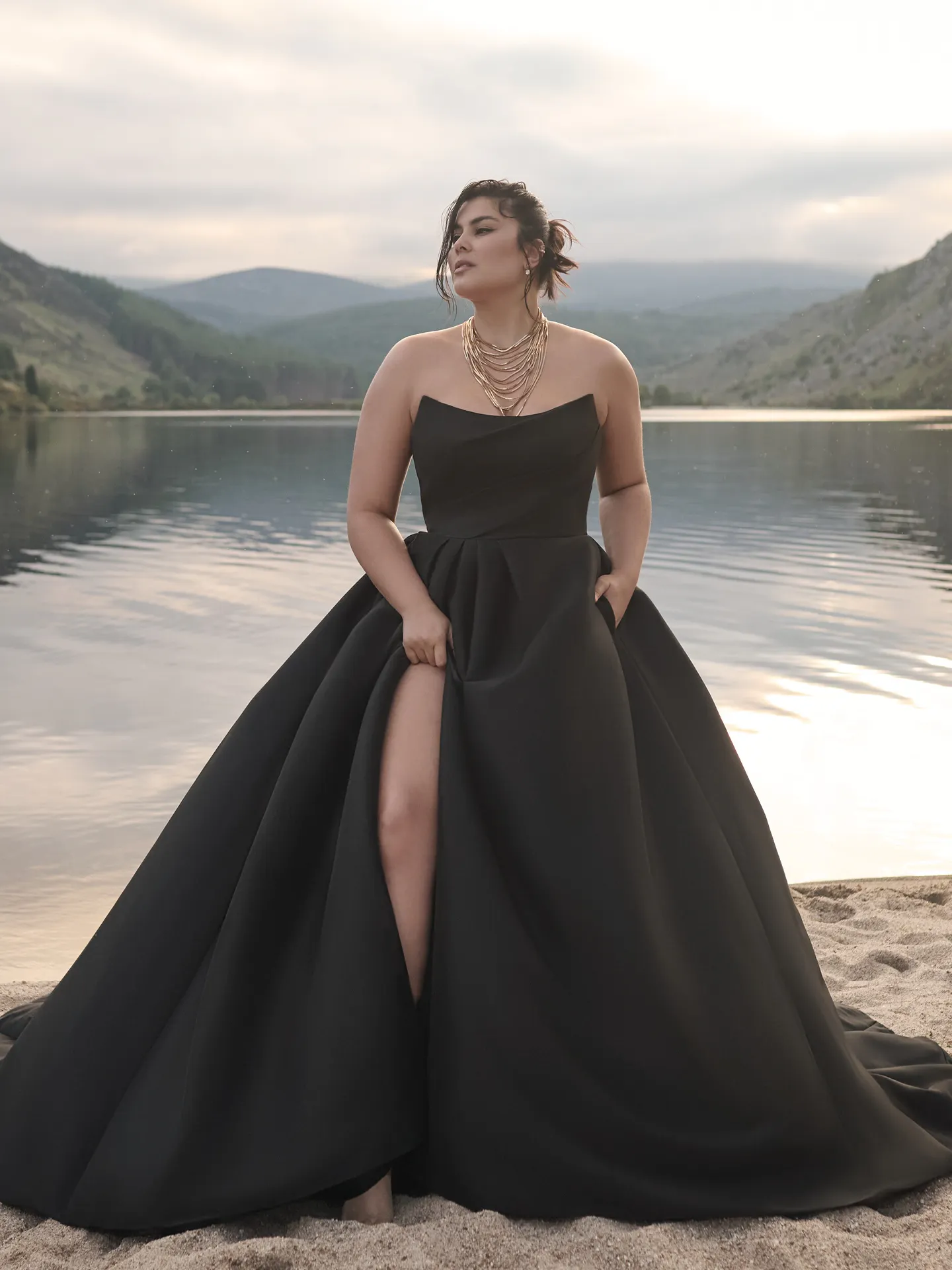 Sottero and Midgley Aspen front view, black strapless A-line dress with thigh slit.