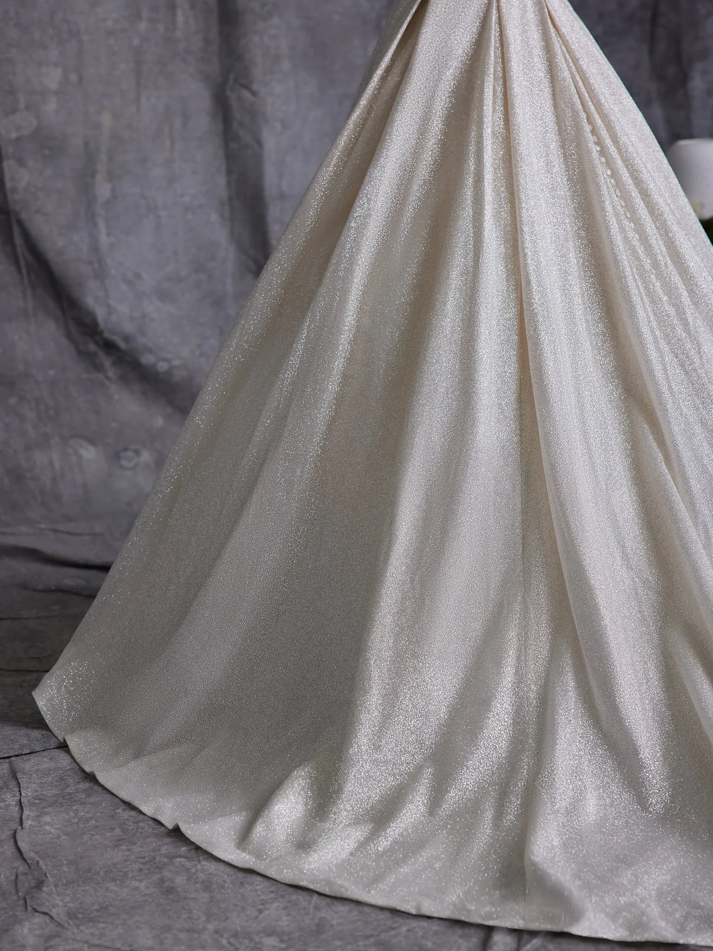 Maggie Sottero Anniston shimmery ballgown showcasing fabric texture