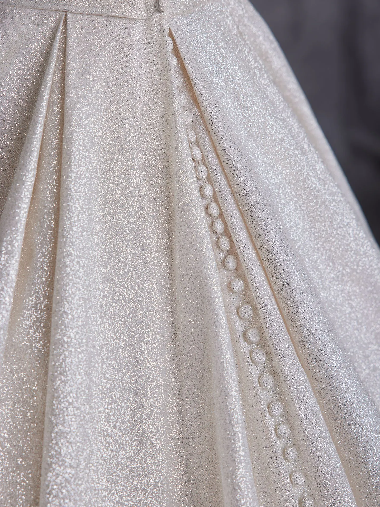 Maggie Sottero Anniston shimmery ballgown detail with buttons