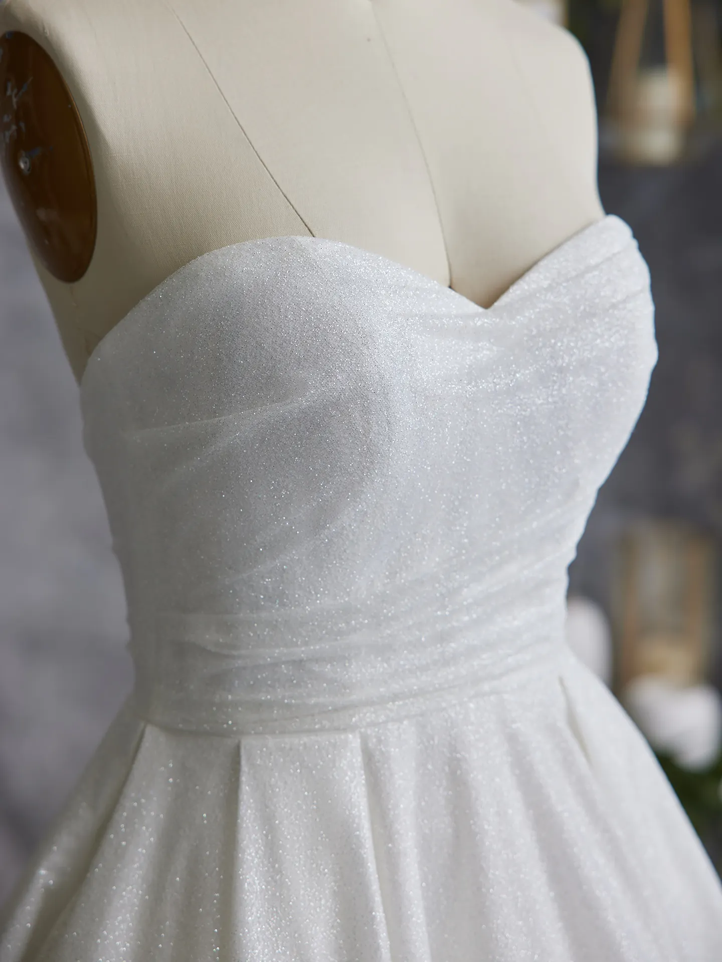 Maggie Sottero Anniston shimmery ballgown bodice close-up.