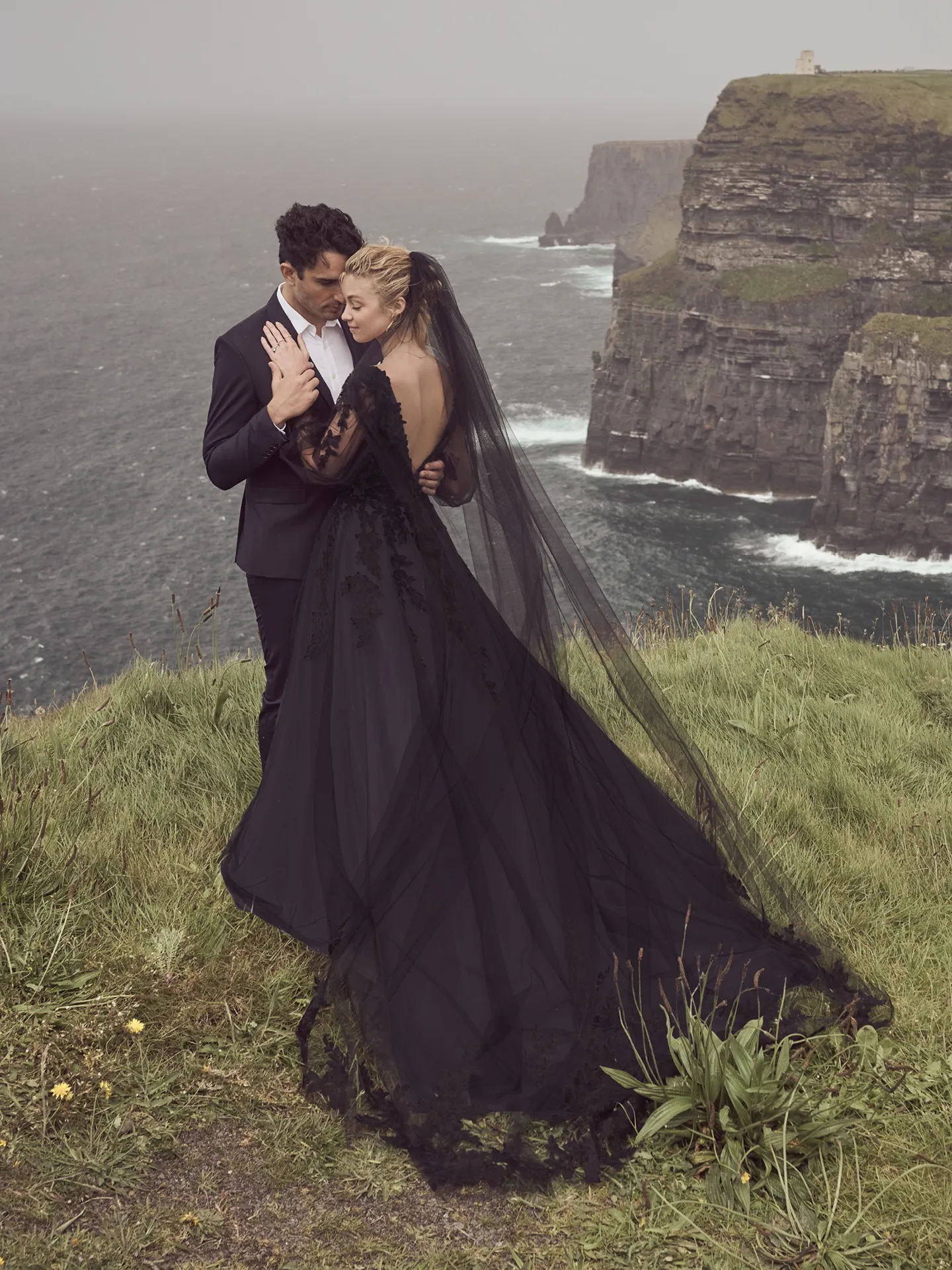 Rebecca Ingram black bridal veil, back view, on cliffside.