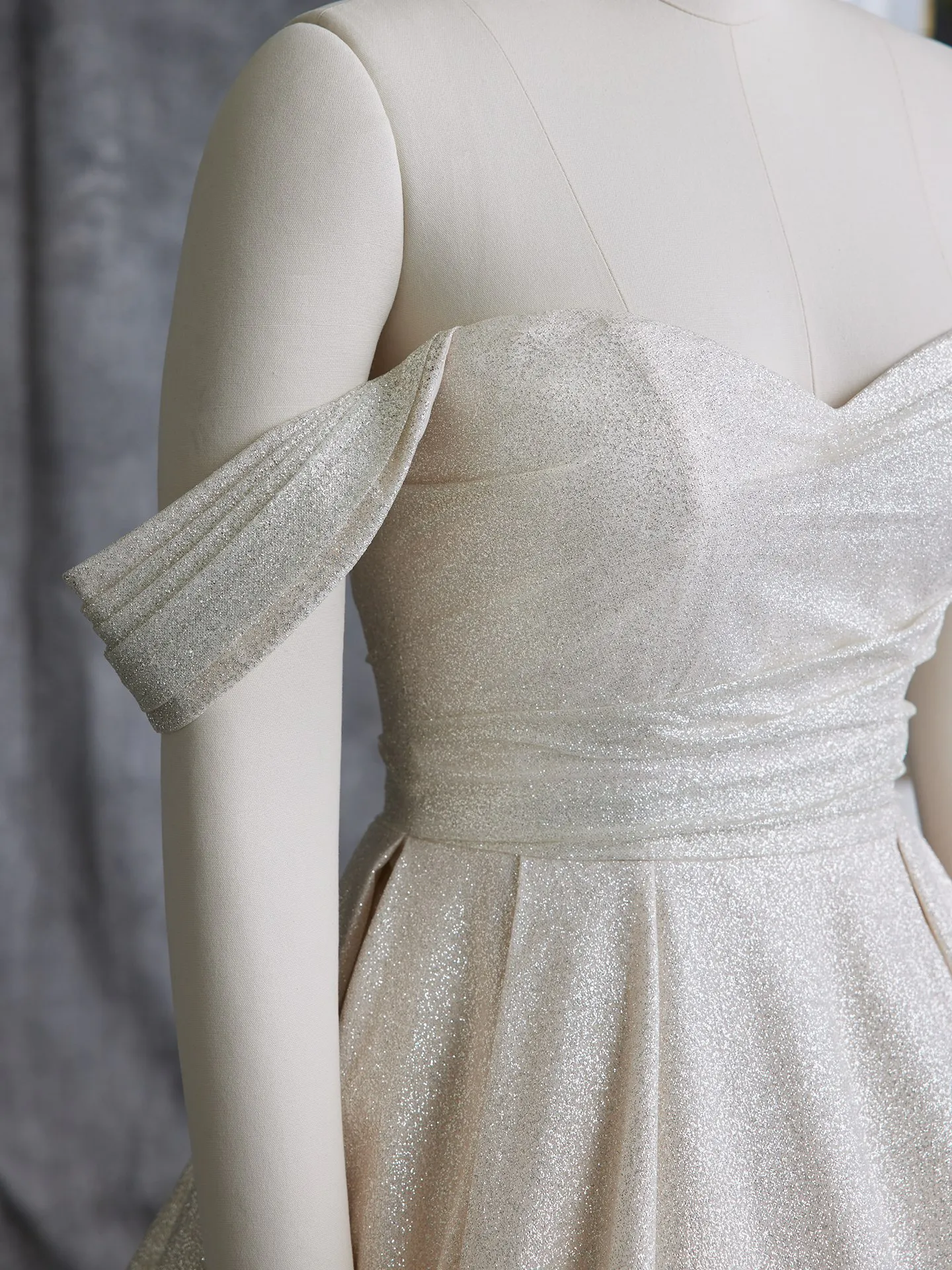 Maggie Sottero Anniston front view off-the-shoulder cap sleeves sparkly gown.