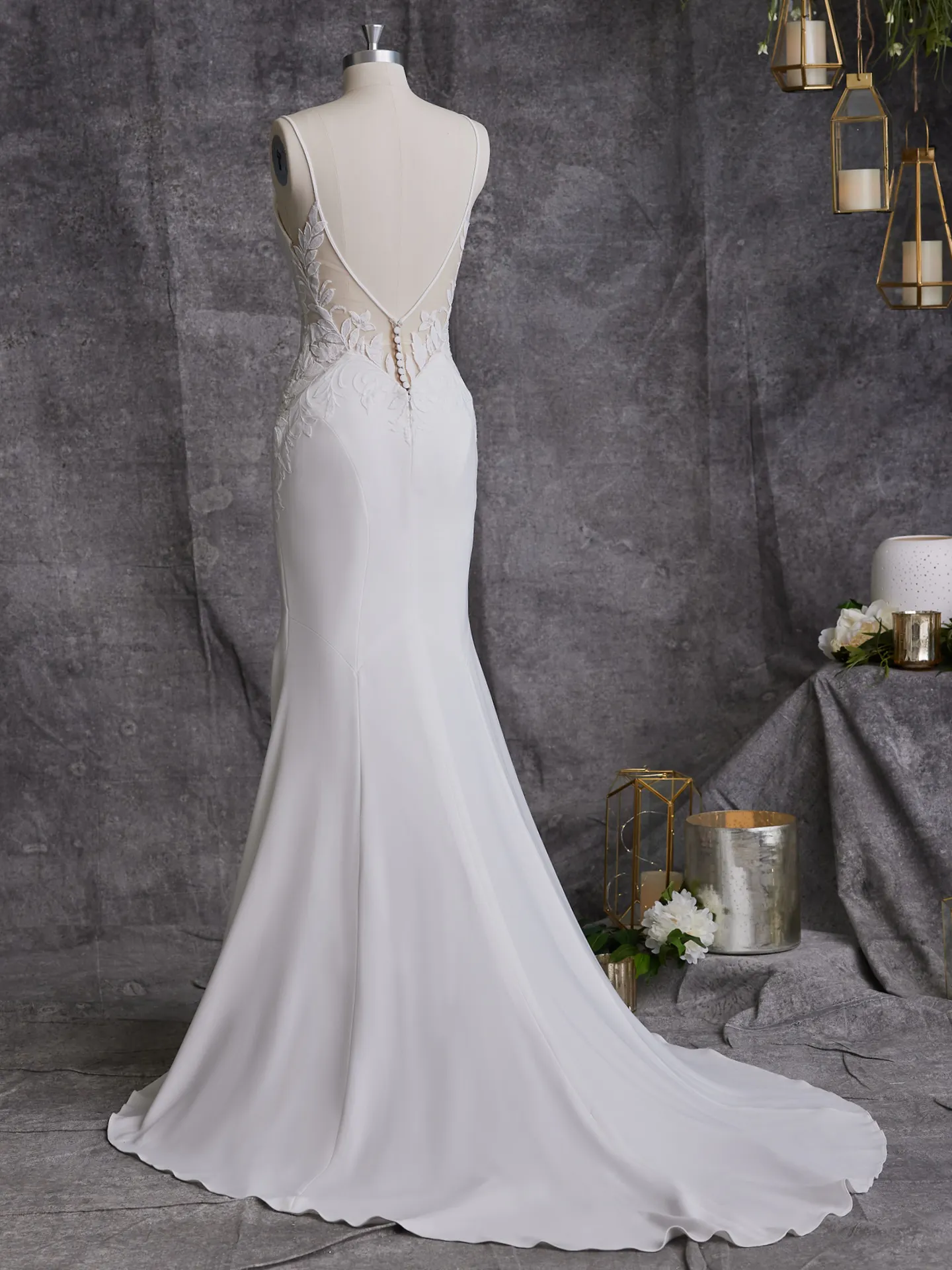 Rebecca Ingram Dionne back view crepe wedding dress with V-neck and lace detail.