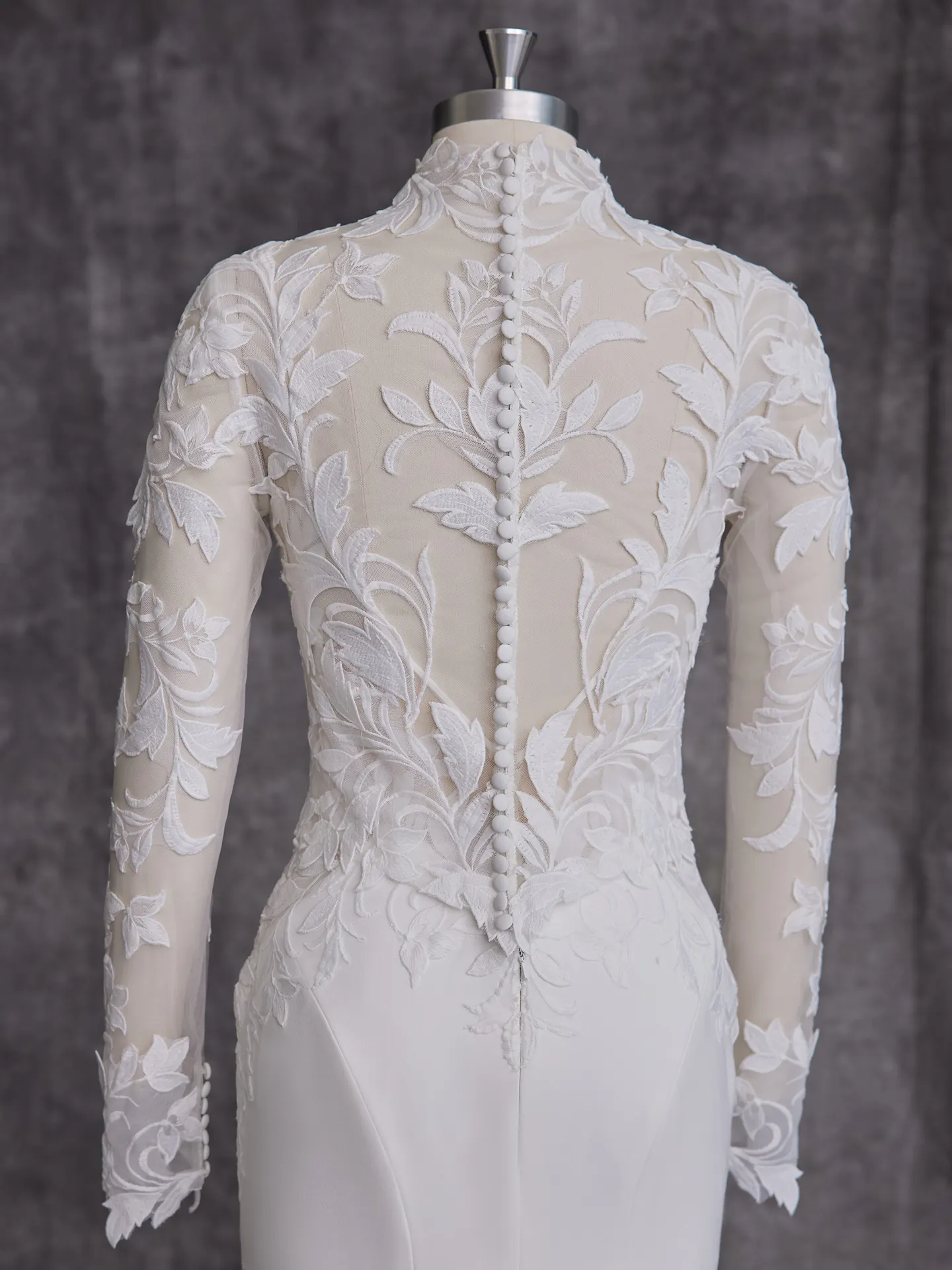 Rebecca Ingram Dionne back view, floral lace and button detail on crepe wedding dress.