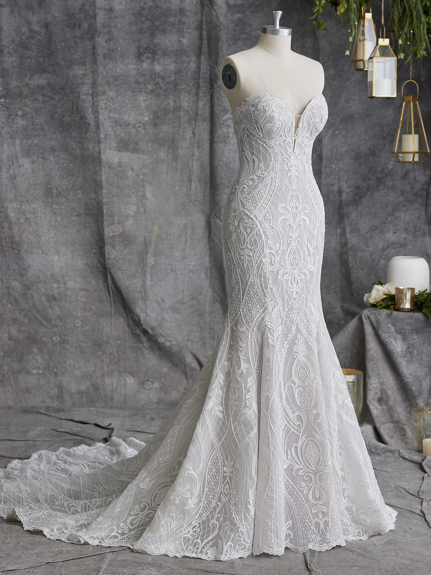 Sottero and Midgley Bronson front view lace fit-and-flare gown with train on mannequin
