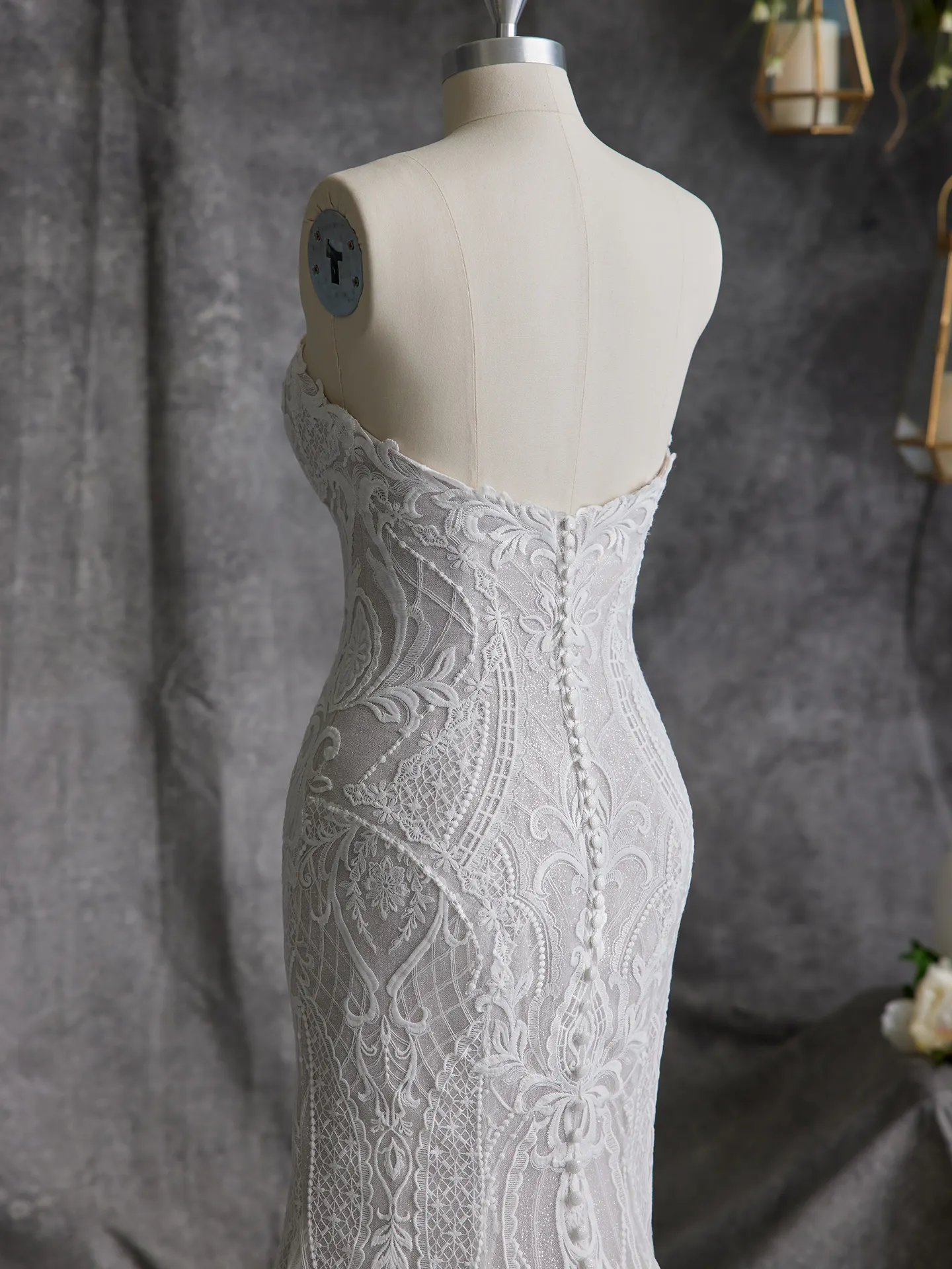 Sottero and Midgley Bronson gown back view on mannequin with lace detail.