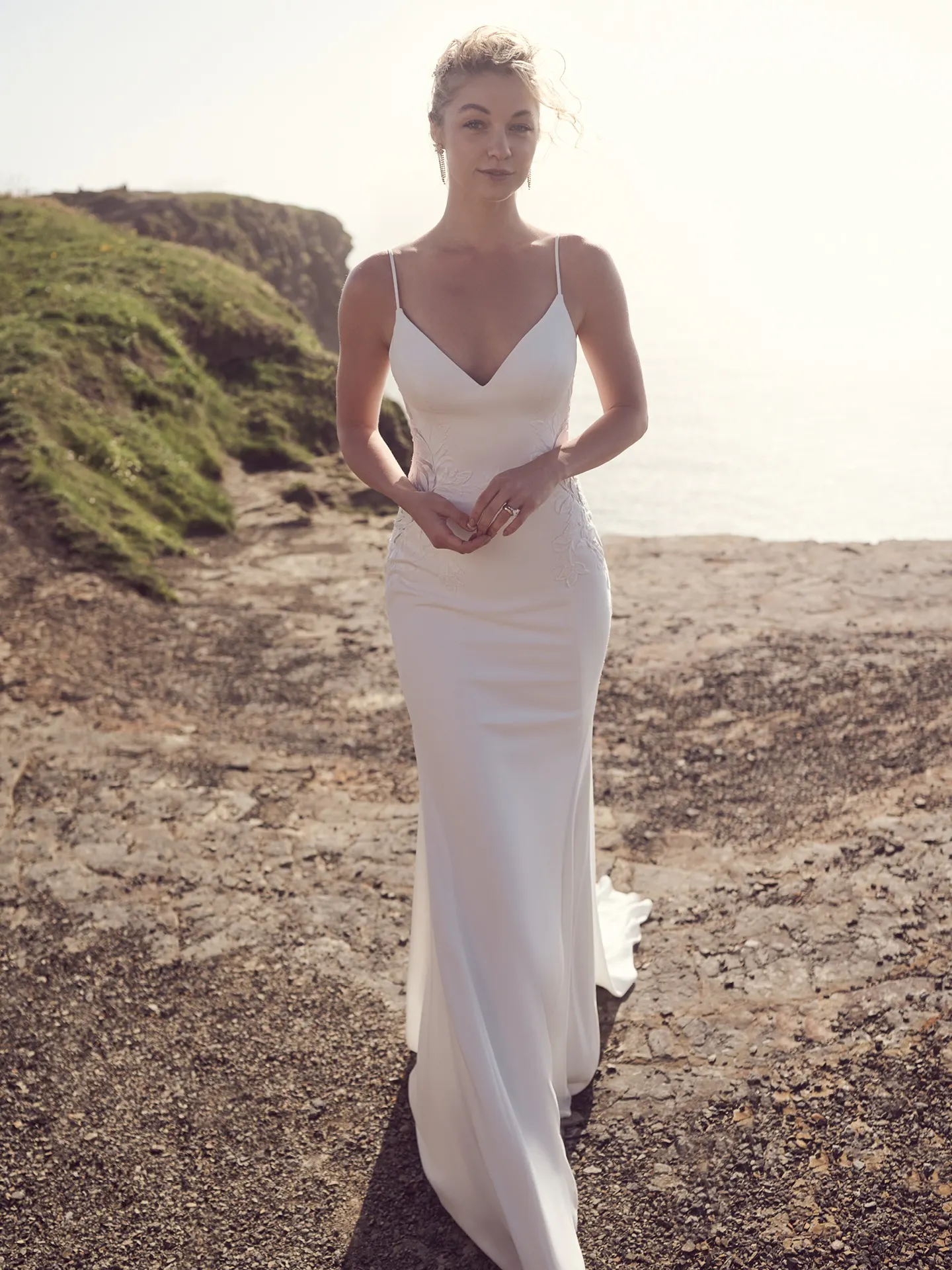 Rebecca Ingram Dionne front view V-neck crepe wedding dress outdoors