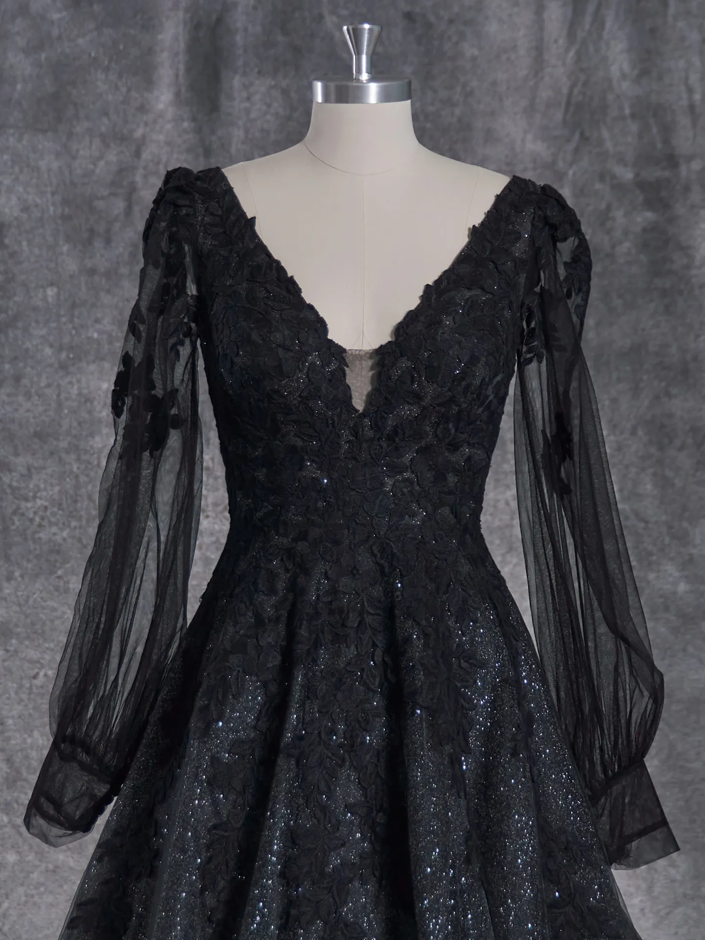 Maggie Sottero Alexandria front view with bishop sleeves and lace on mannequin