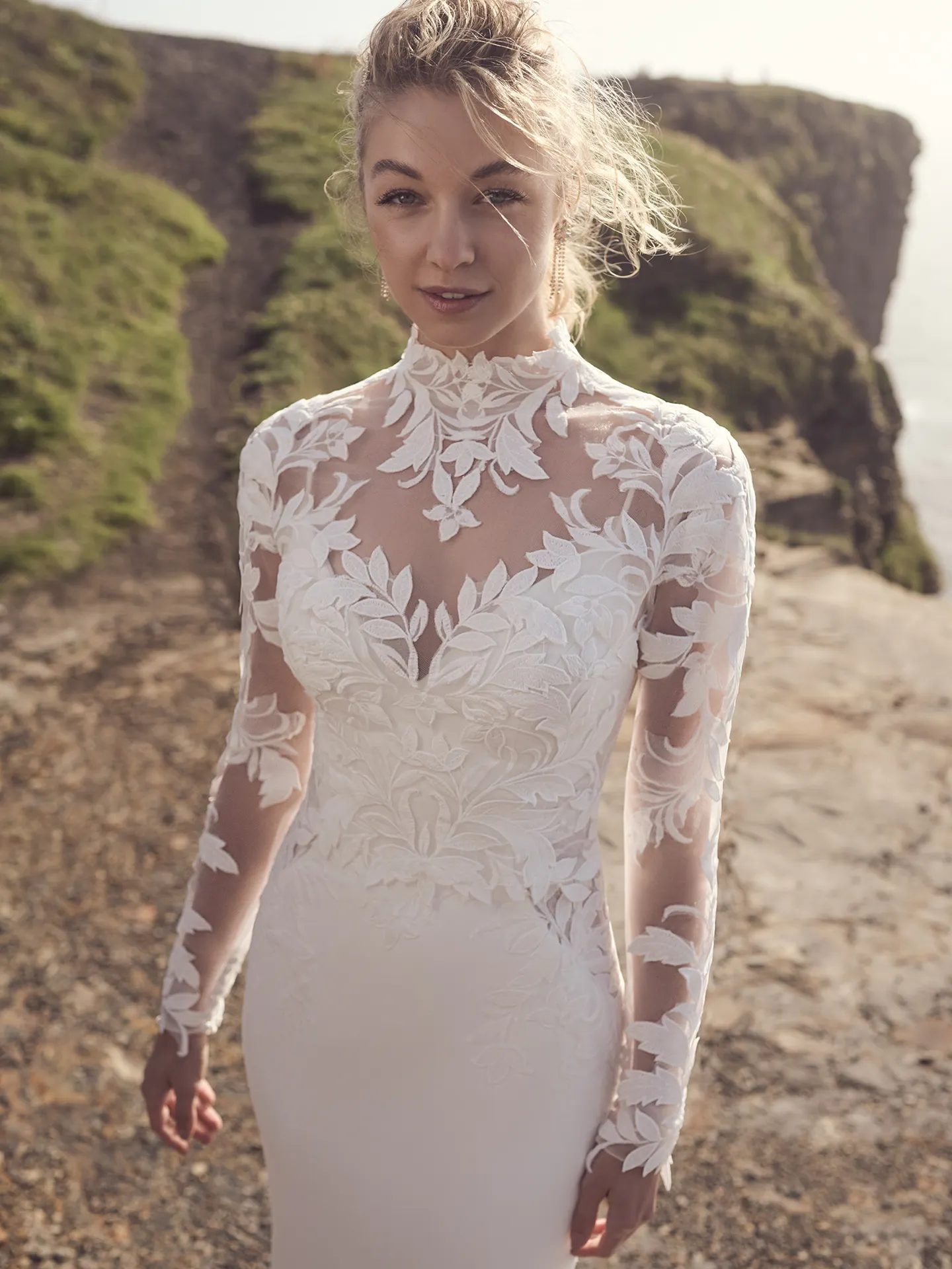 Rebecca Ingram Dionne front view lace detail on cliffside path