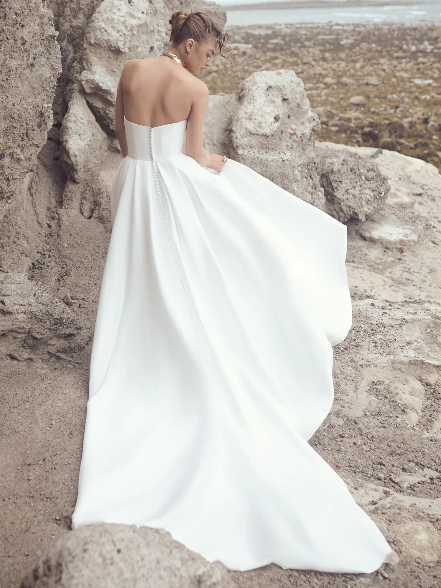 Sottero and Midgley Aspen back view A-line strapless wedding dress outdoors