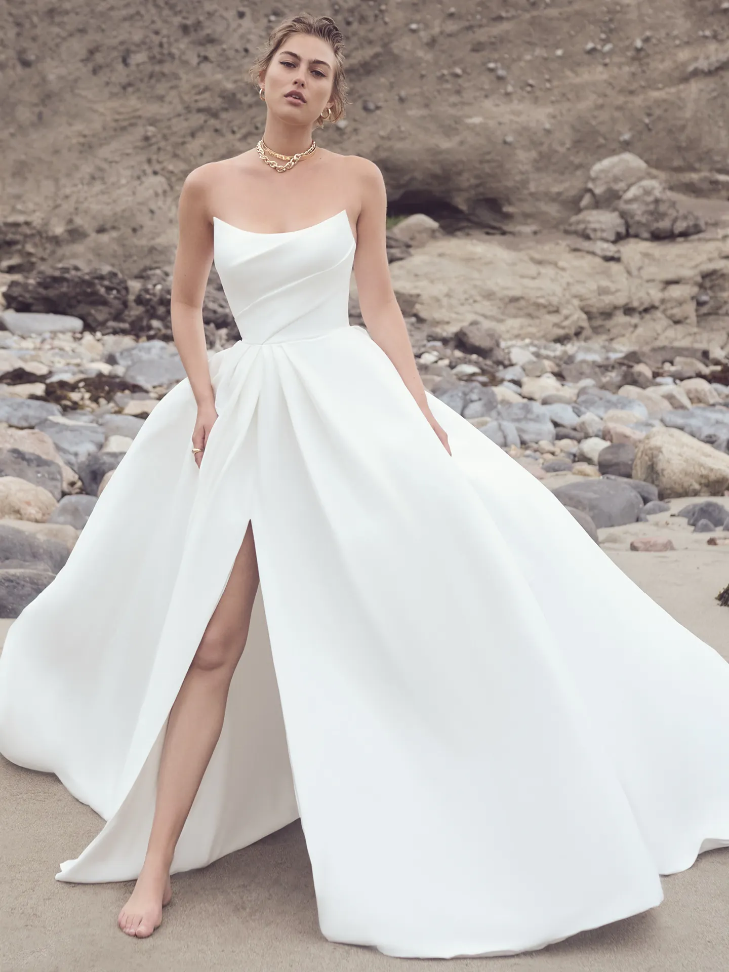 Aspen A-line strapless gown front view on beach, Sottero and Midgley.