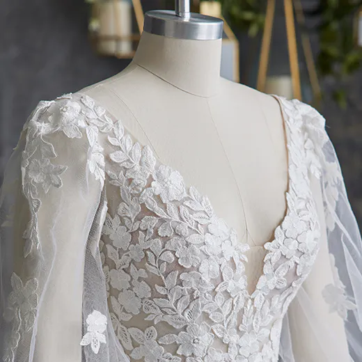 Alexandria wedding dress with floral lace sleeves on mannequin, Maggie Sottero.