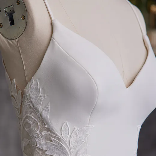 Rebecca Ingram Dionne V-neck crepe dress side detail with floral lace embroidery.