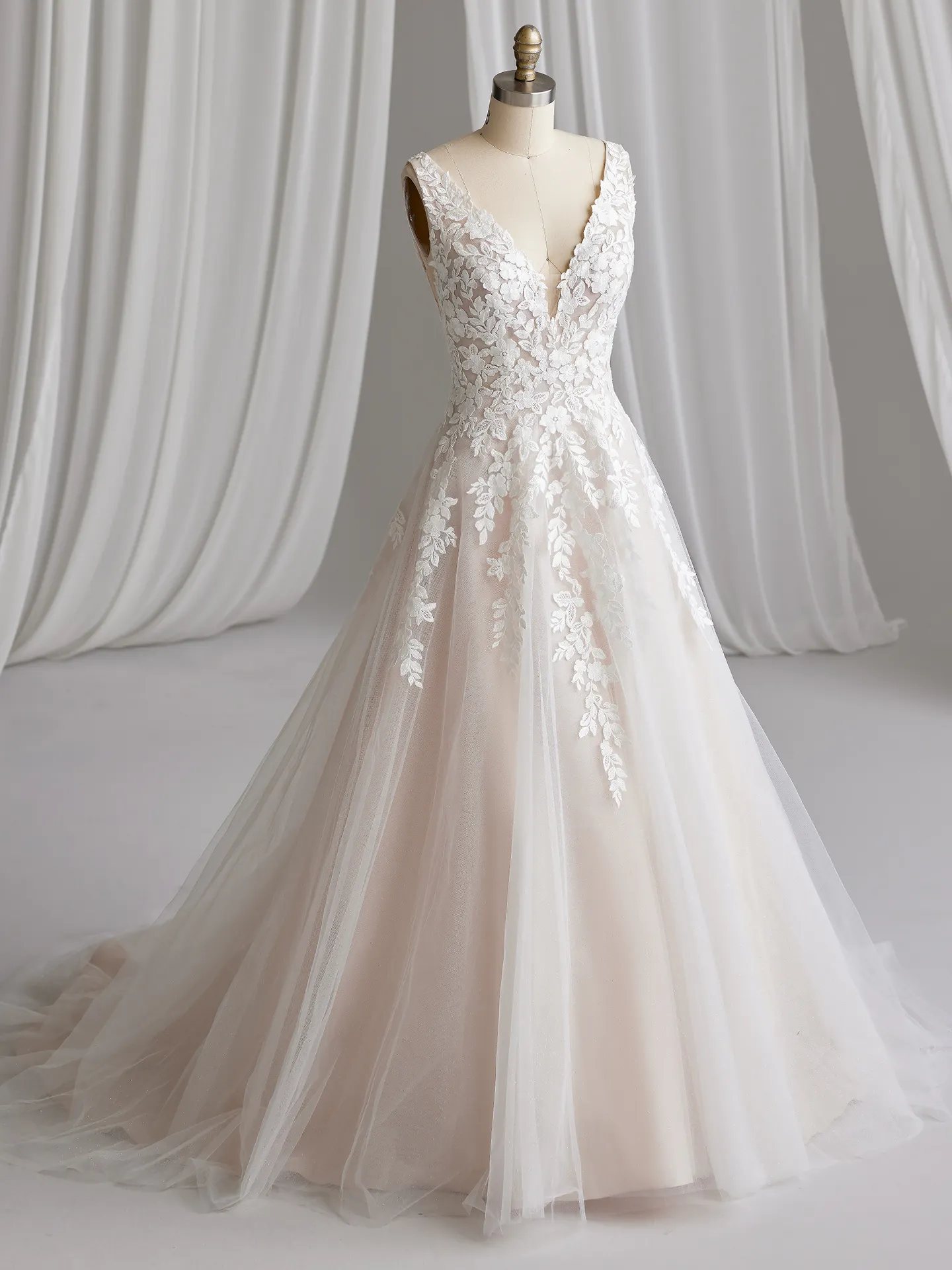 Maggie Sottero Alexandria front view wedding dress with floral lace and bishop sleeves.