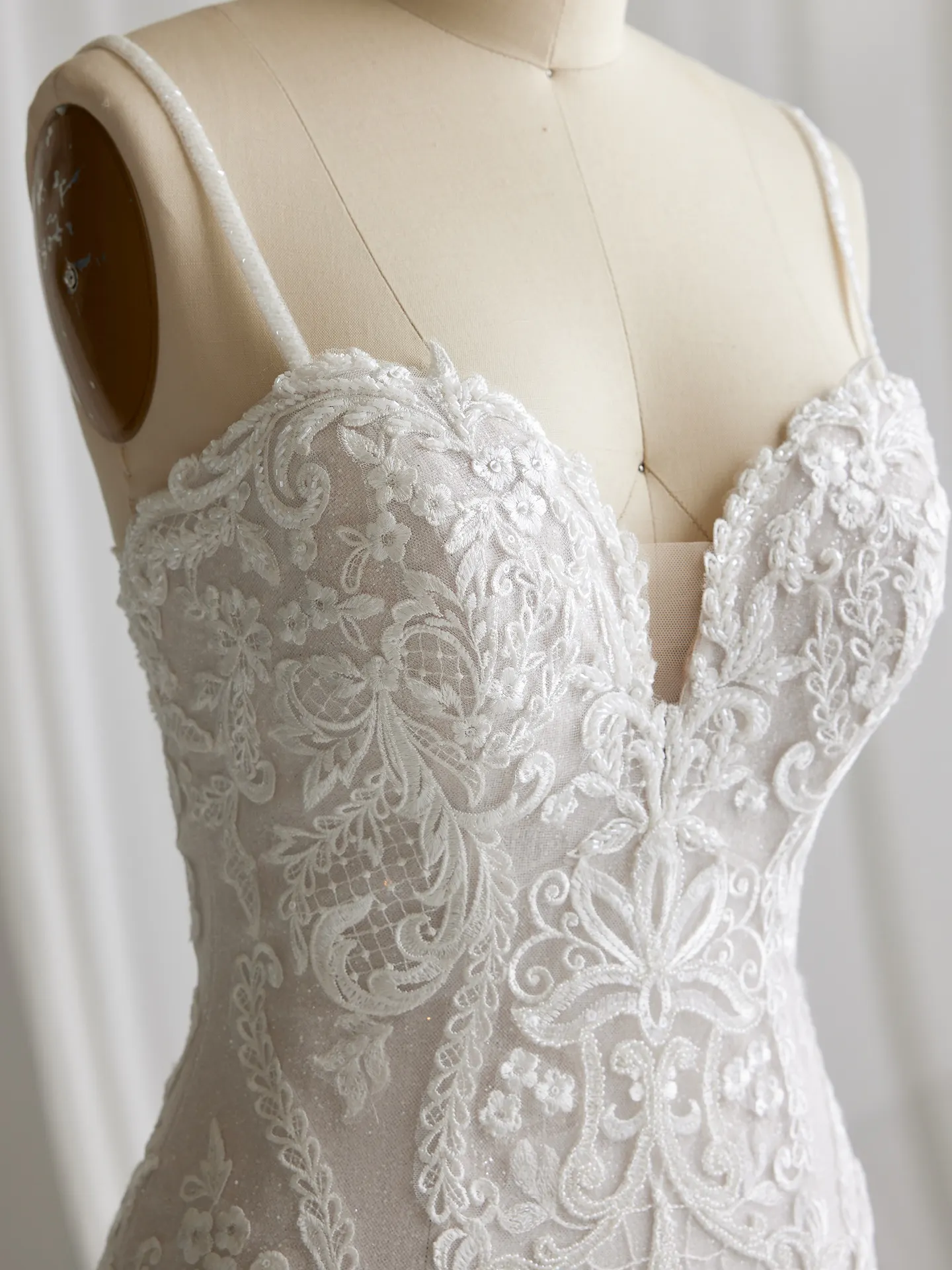 Maggie Sottero Frederique lace detail close-up on mannequin
