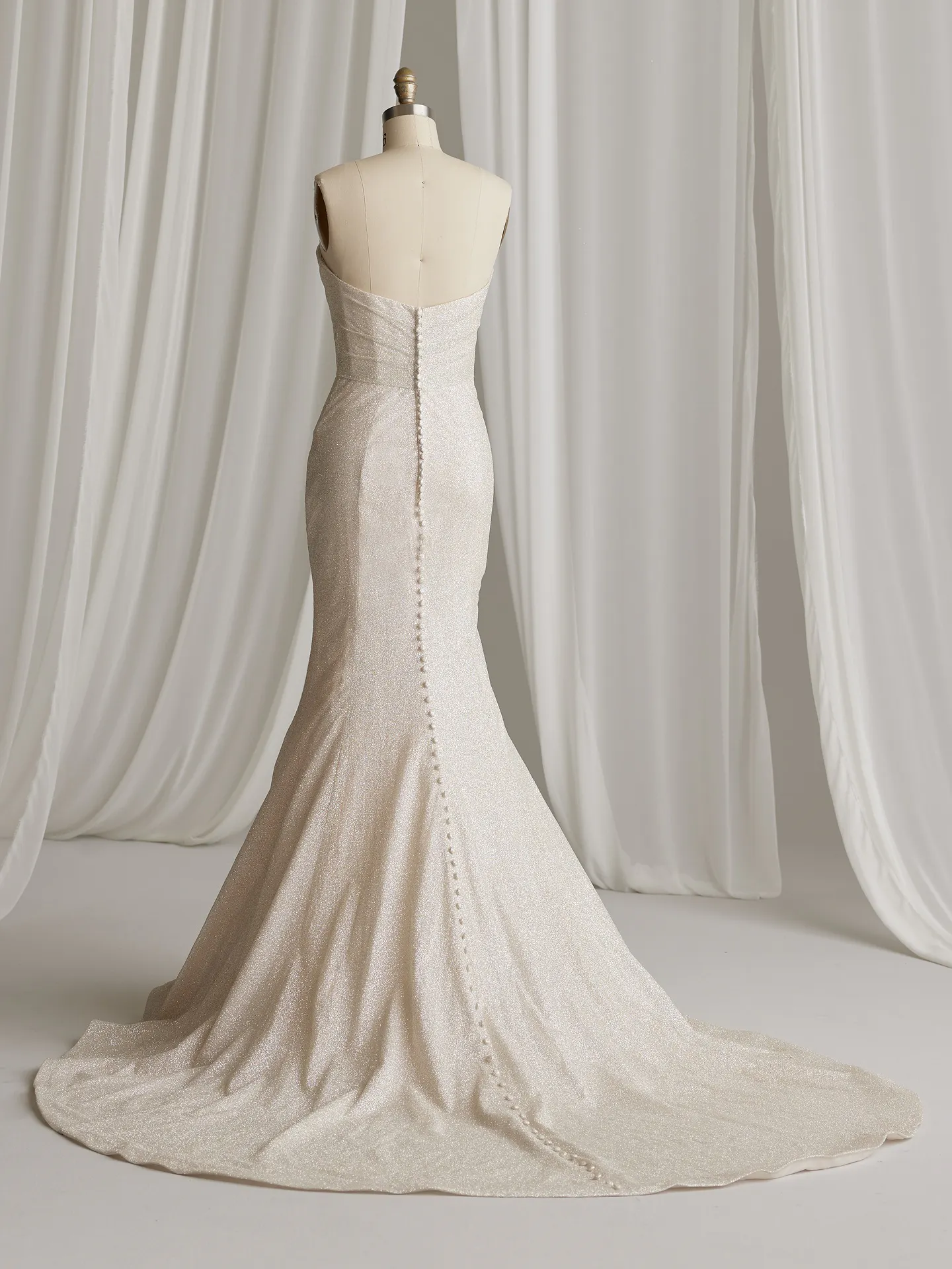 Maggie Sottero Anniston Lane back view fit and flare bridal gown in glitter fabric