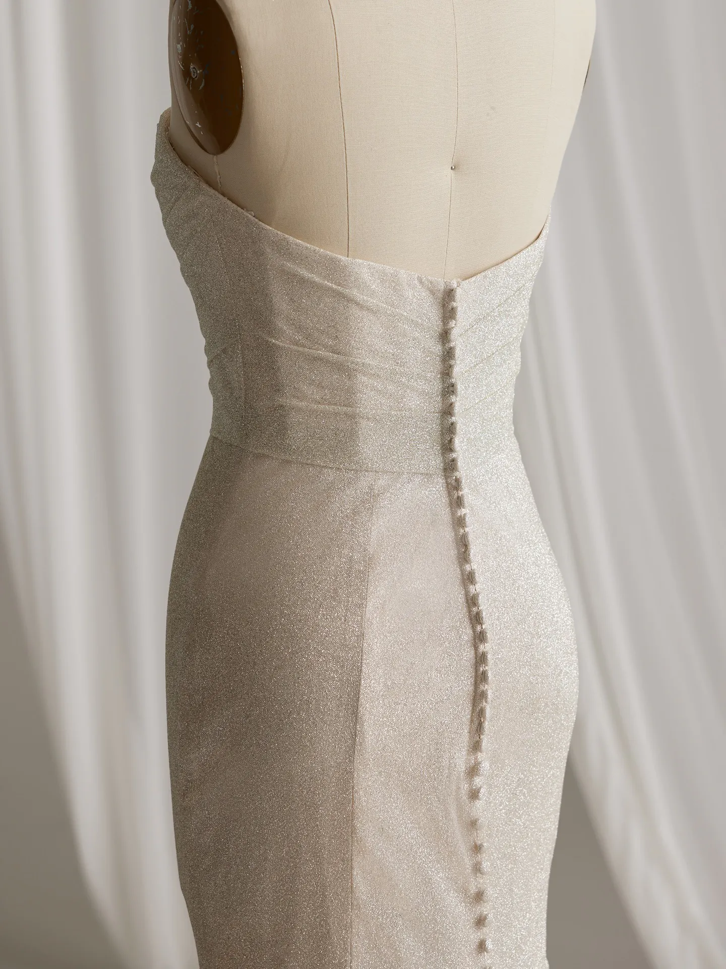 Maggie Sottero Anniston Lane glitter fit-and-flare back view with buttons