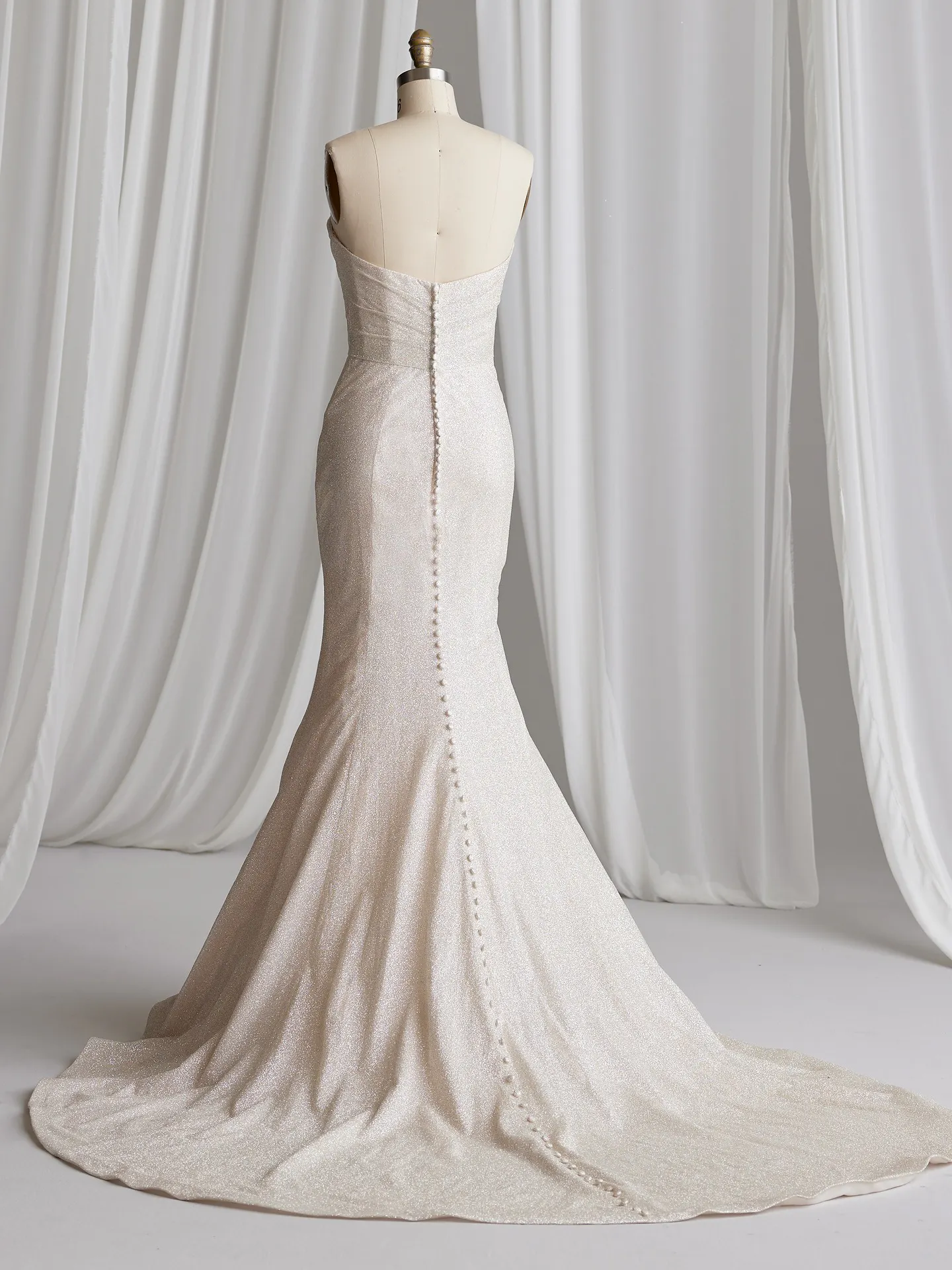 Maggie Sottero Anniston Lane back view fit-and-flare bridal gown with buttons