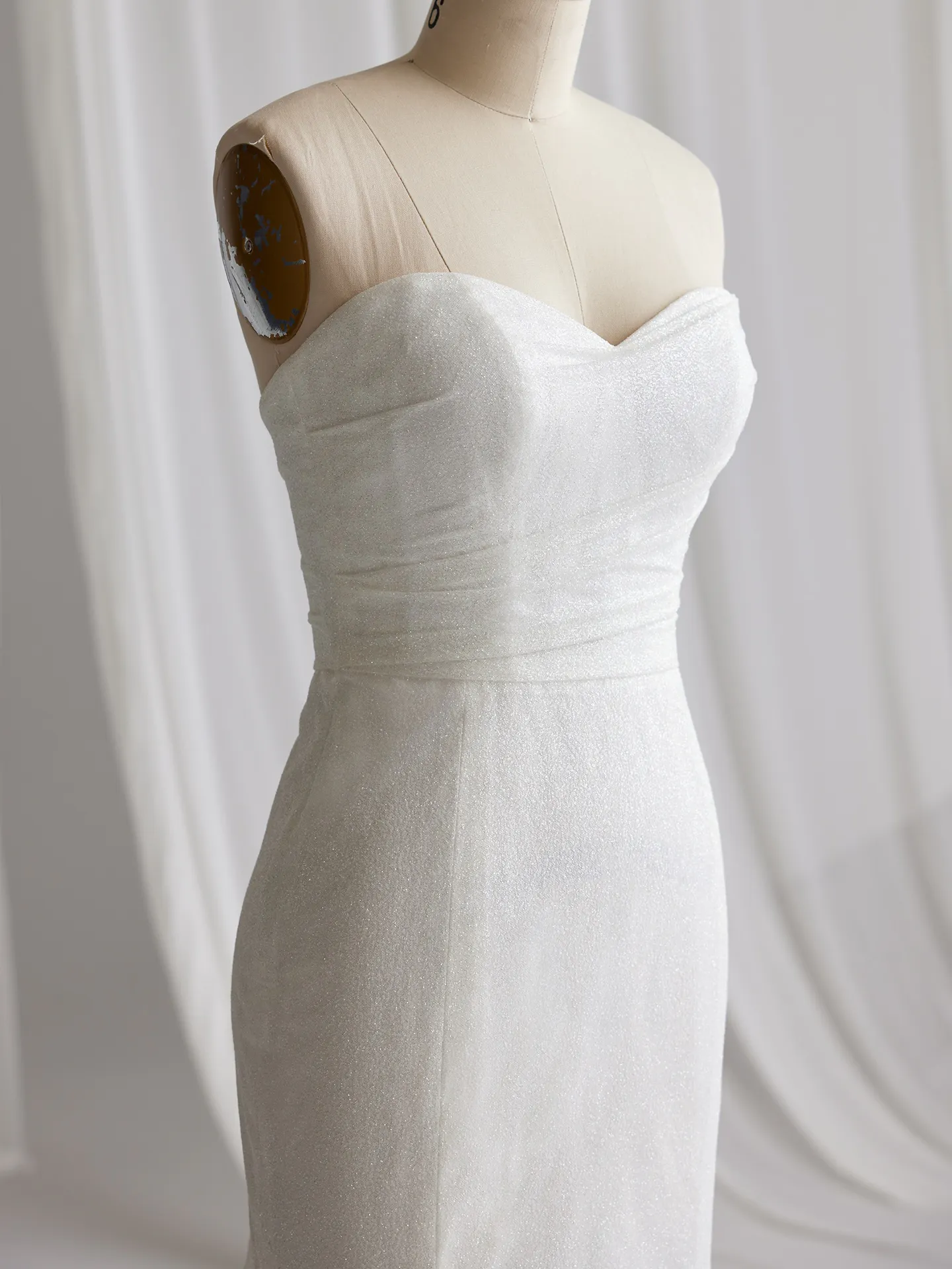 Maggie Sottero Anniston Lane glitter gown side view on mannequin