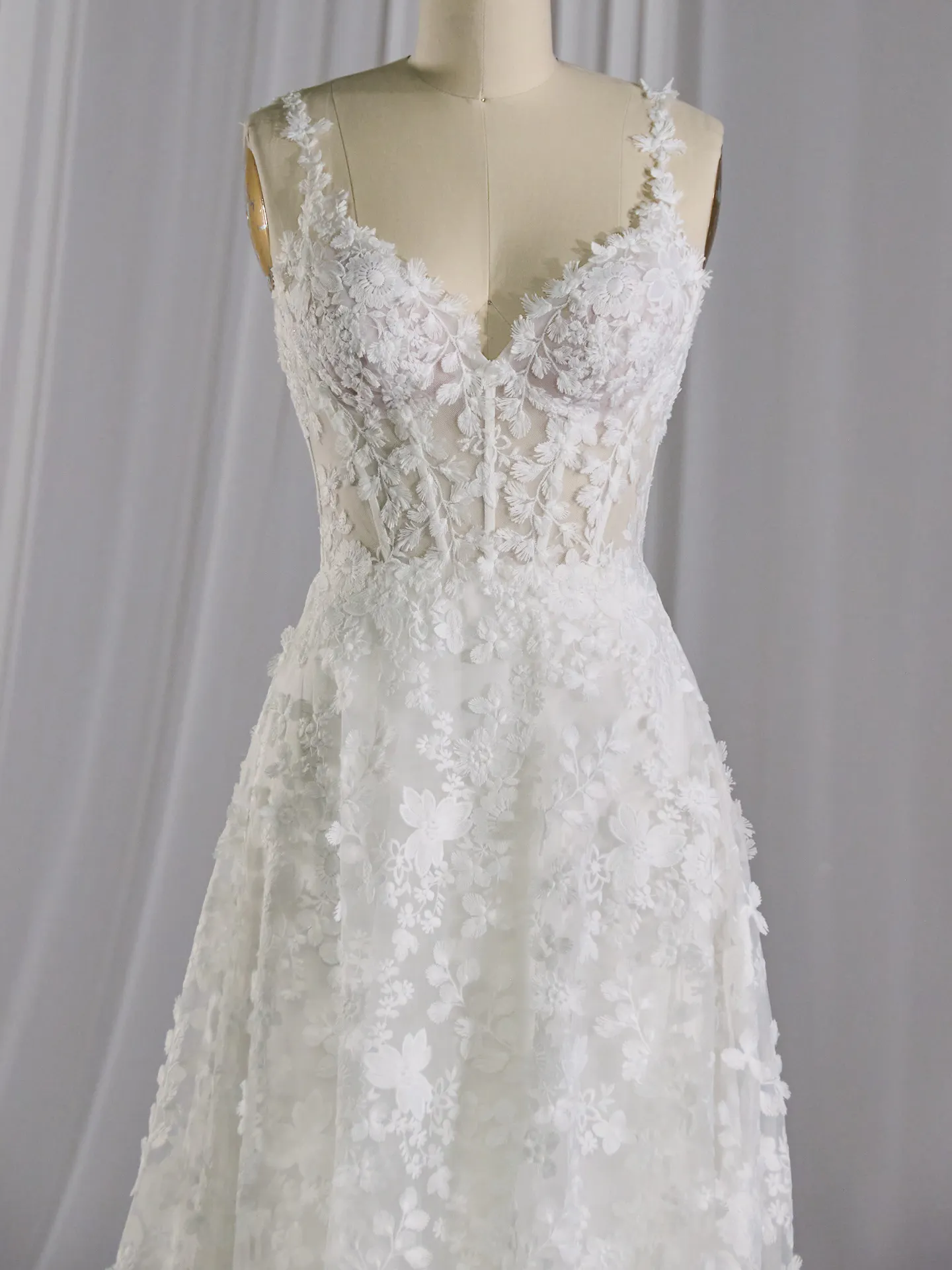 Maggie Sottero Ladonna wedding dress front view with 3D floral detail.