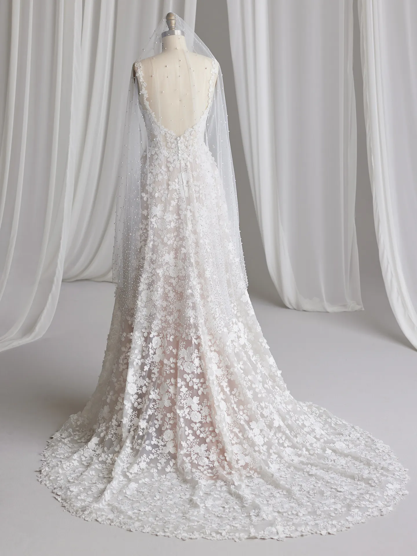 Ladonna wedding dress back view with 3D floral details and veil draping, Maggie Sottero.