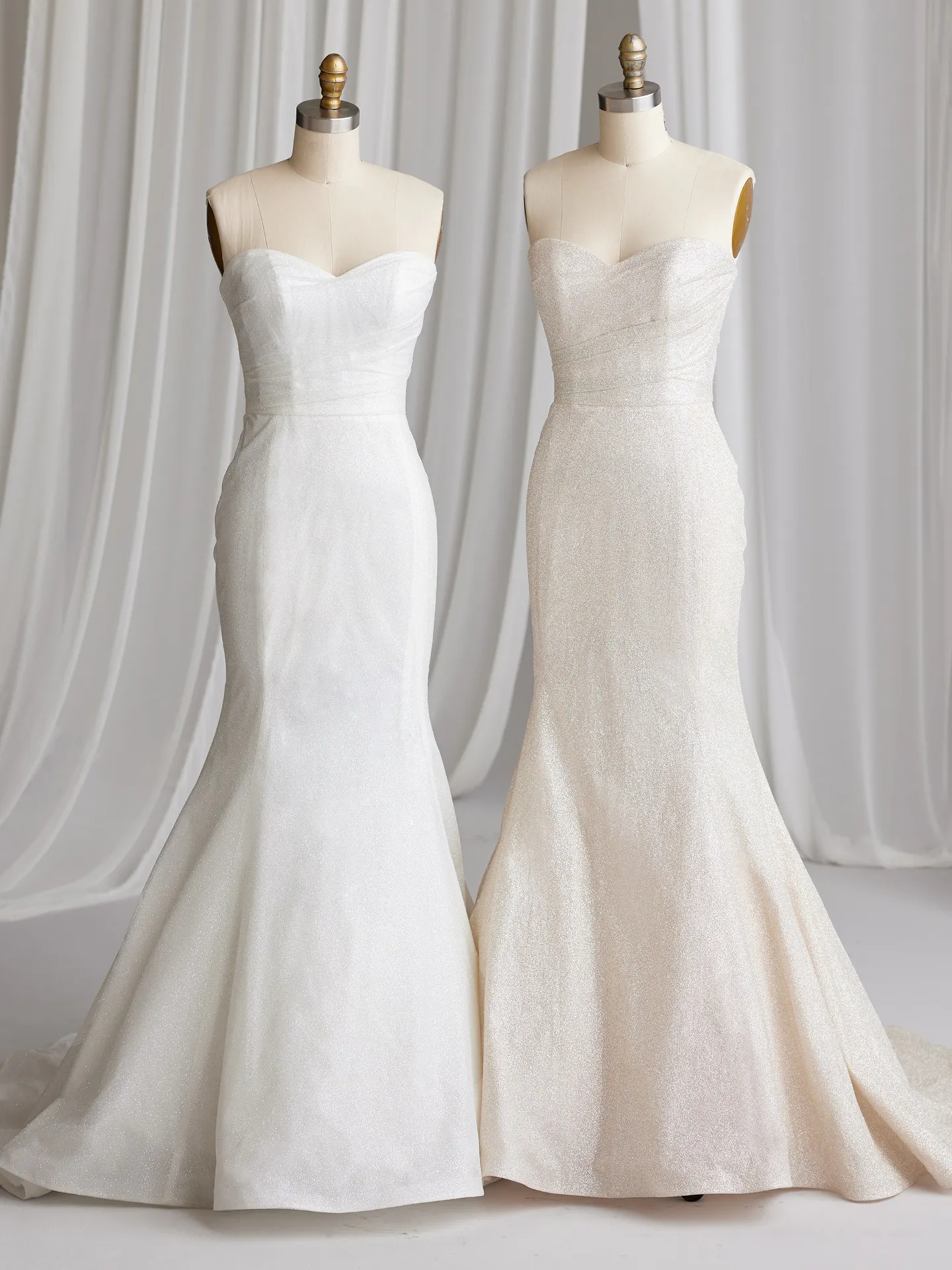 Maggie Sottero Anniston Lane fit-and-flare dresses front view, glitter fabric, on mannequins
