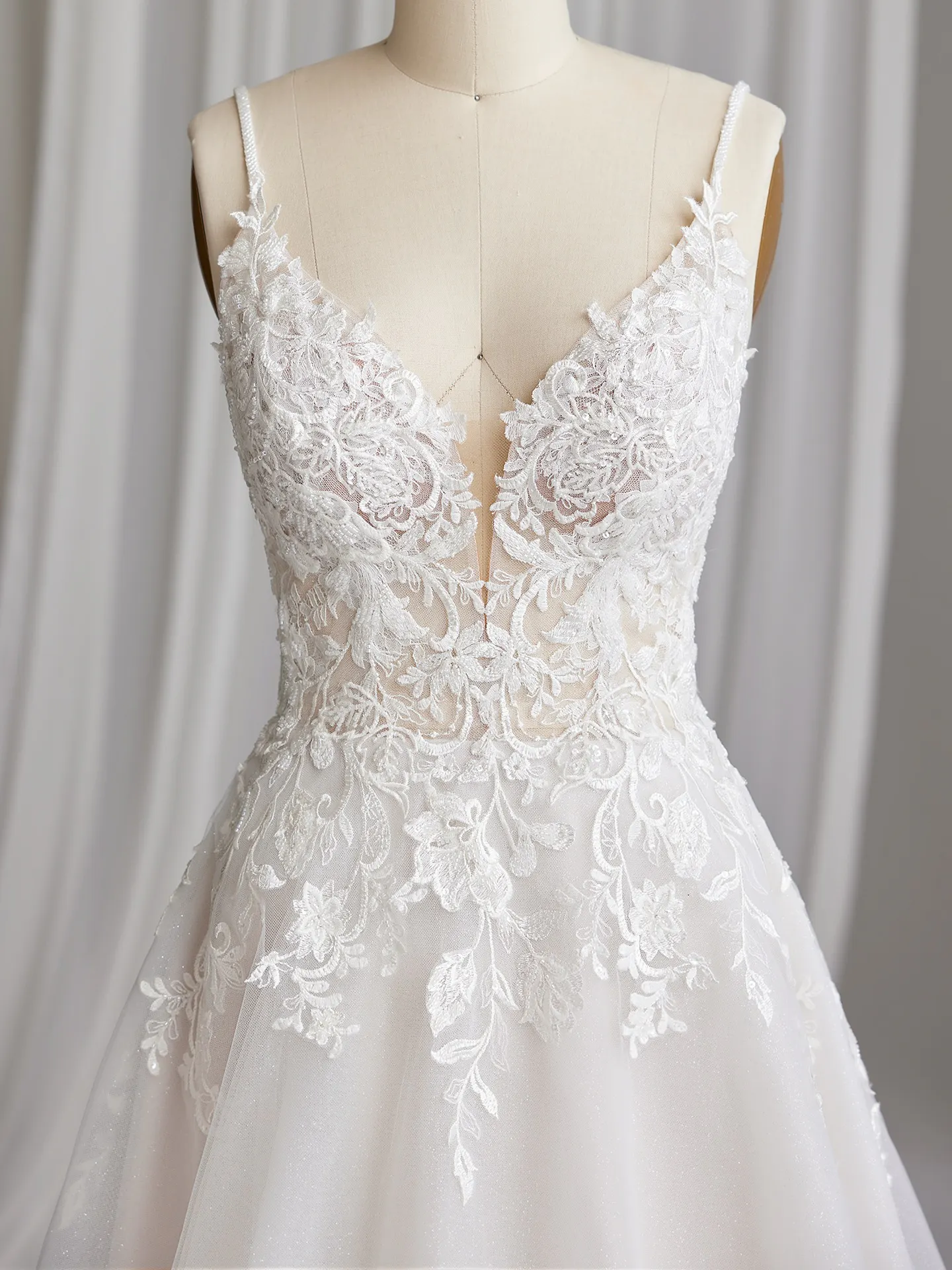 Rebecca Ingram Lizzy front view V-neck sequin A-line wedding gown with floral lace.