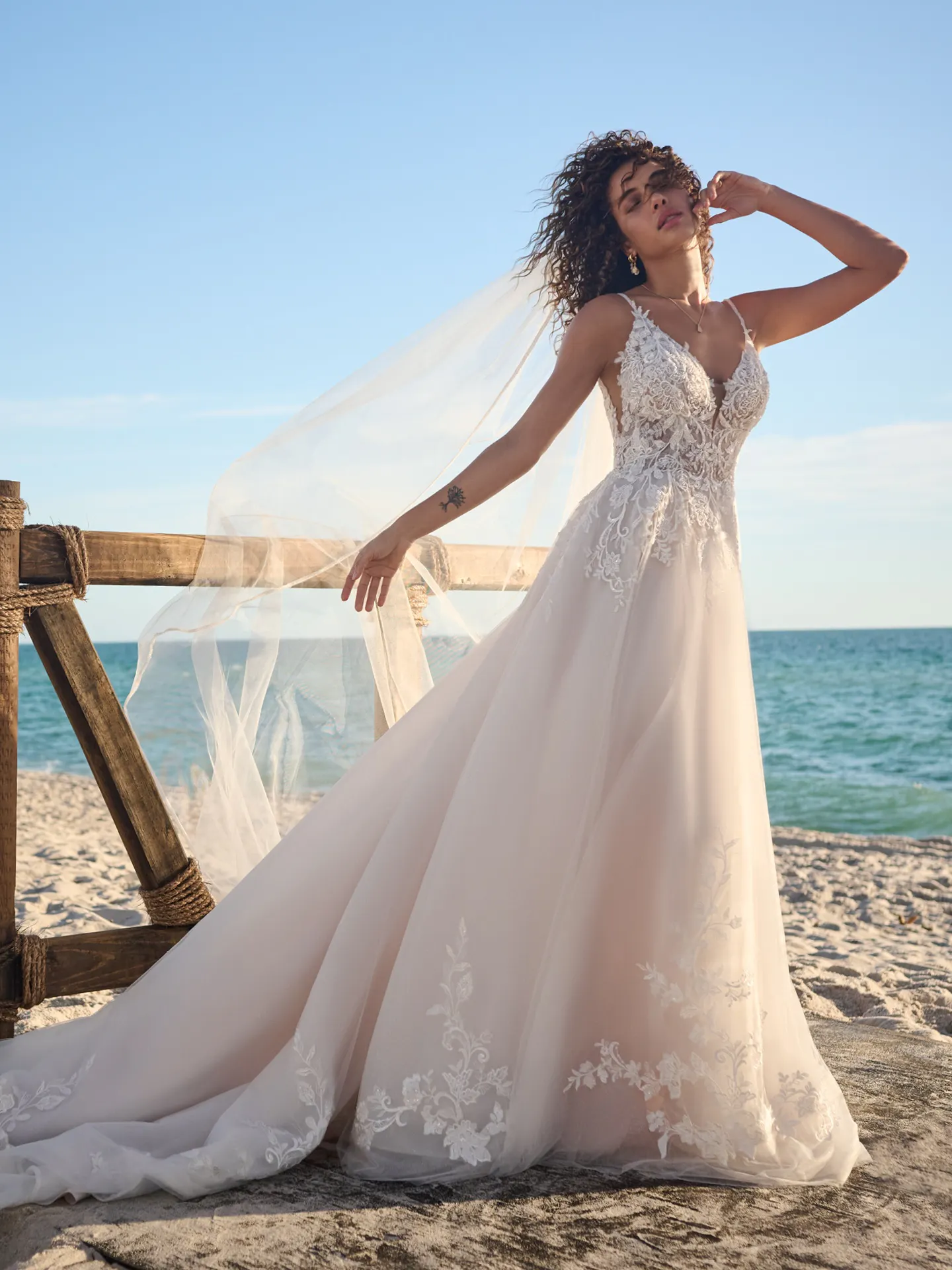 Rebecca Ingram Lizzy V-neck sequin A-line wedding gown front view on beach