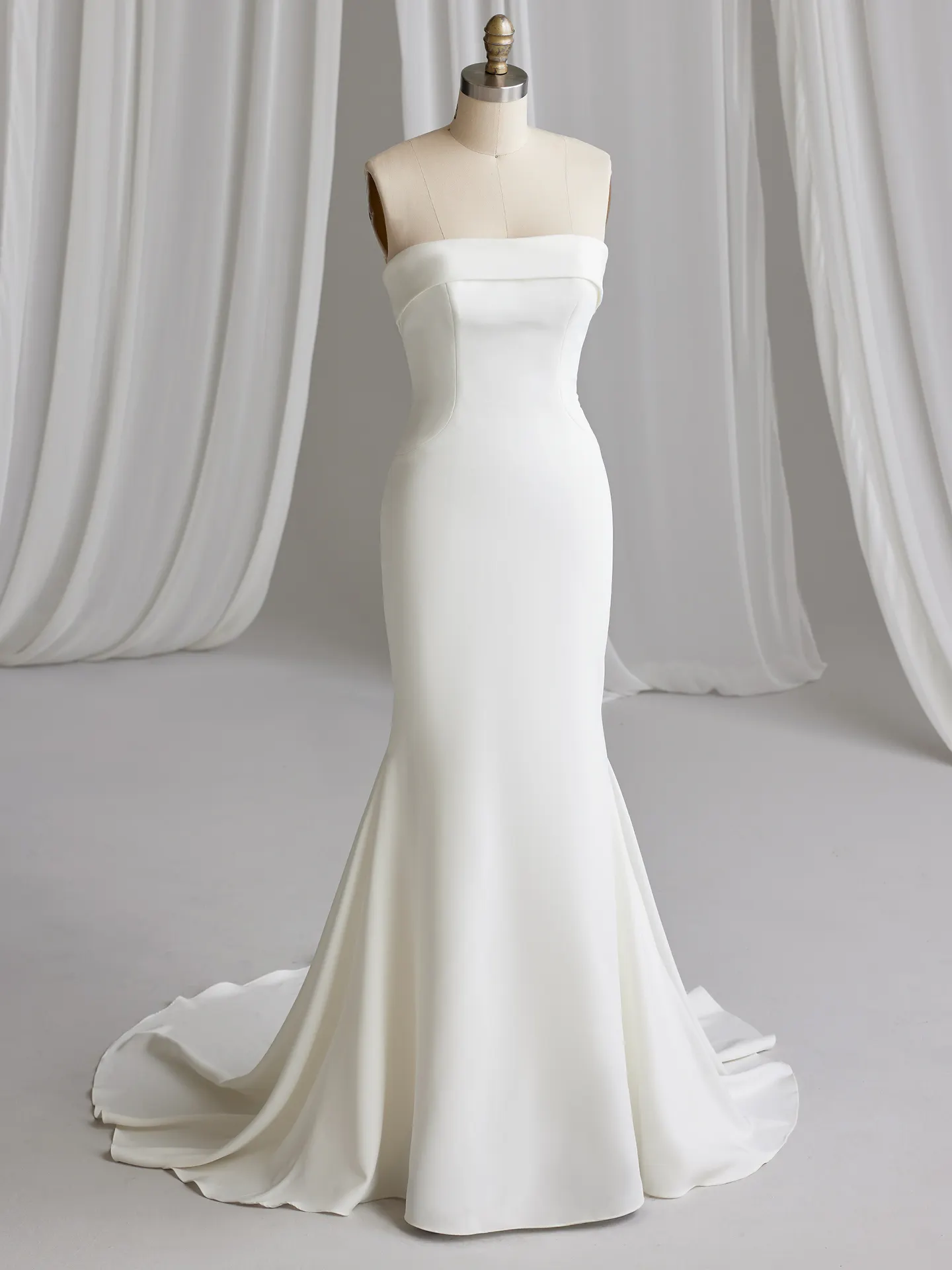 Rebecca Ingram Francine front view, straight neckline crepe bridal dress on mannequin
