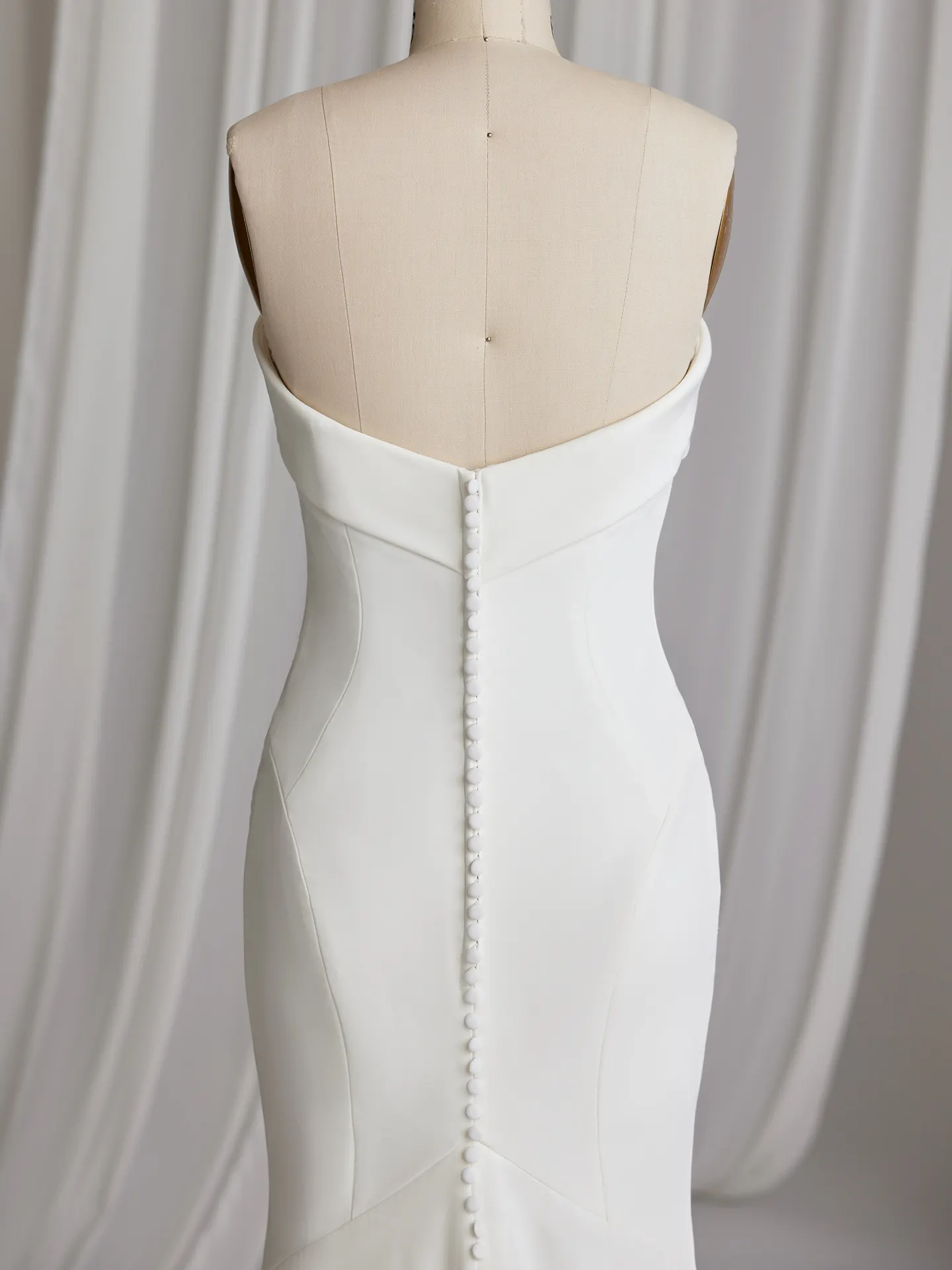 Rebecca Ingram Francine back view with buttons on straight neckline crepe bridal dress