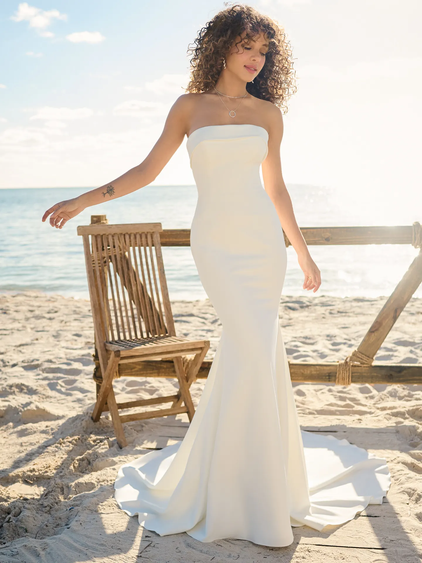 Rebecca Ingram Francine front view, straight neckline crepe bridal dress on beach.